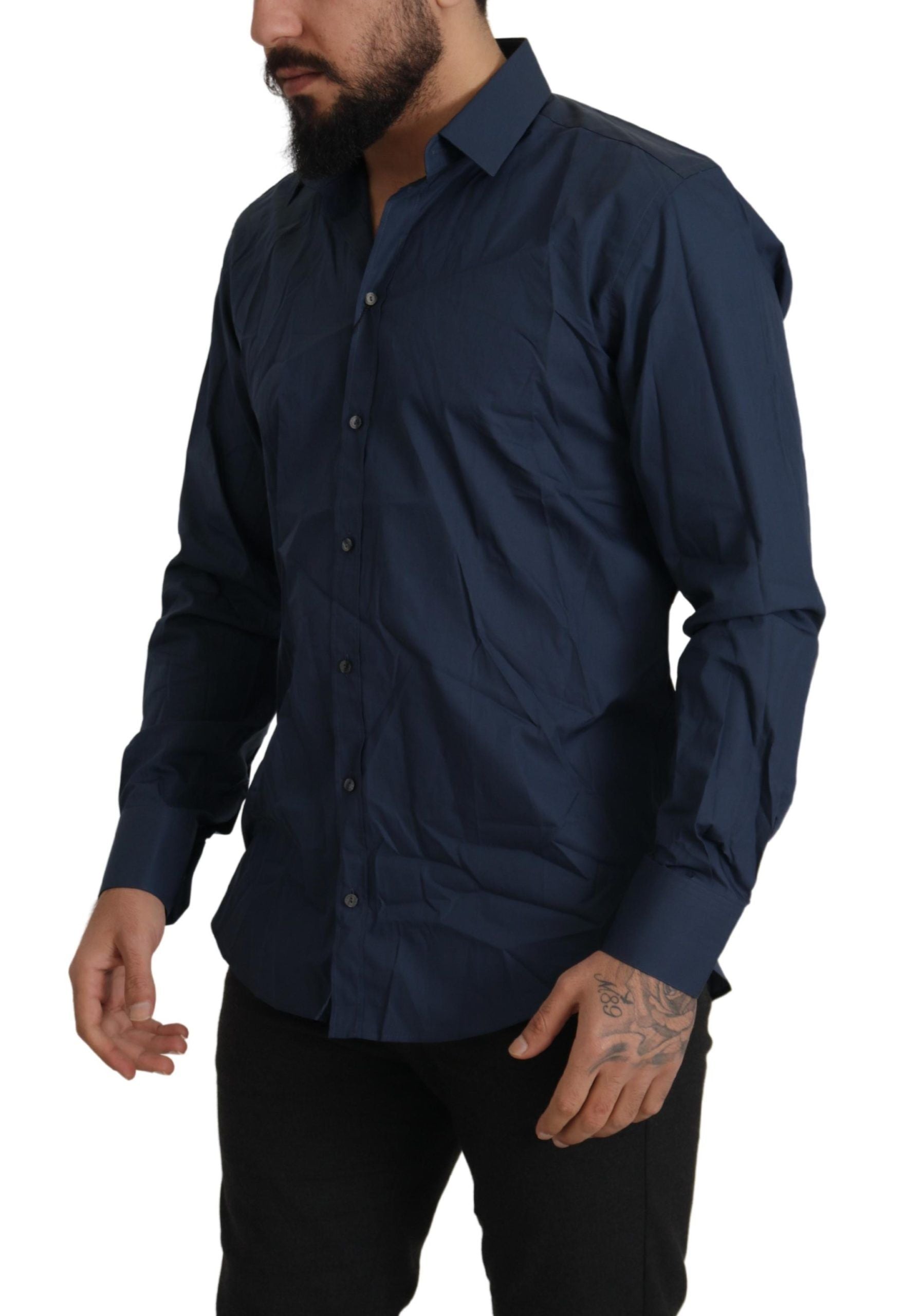 A mannequin wearing a blue cotton Martini slim fit dress shirt