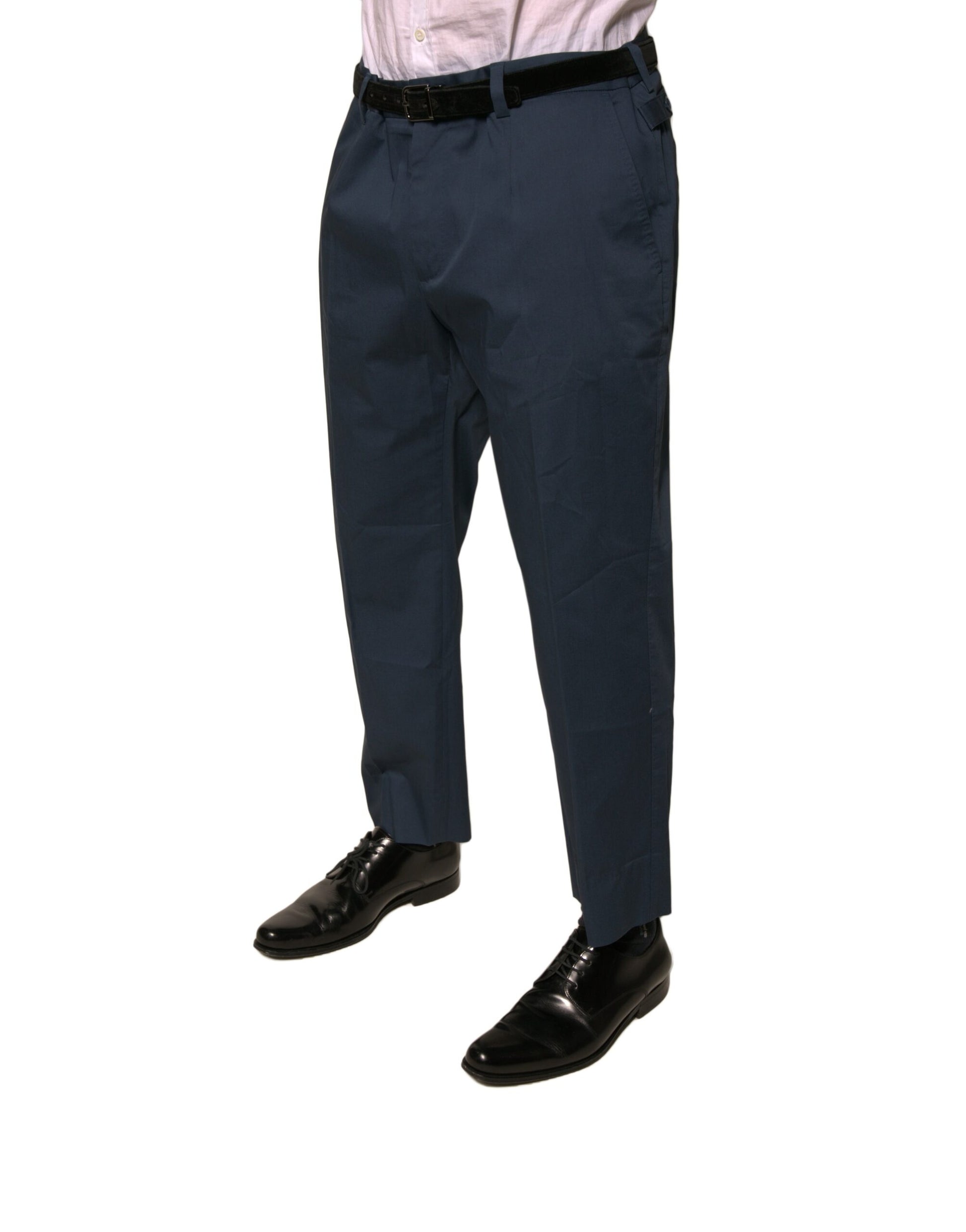 Man wearing blue dress pants and black shoes
