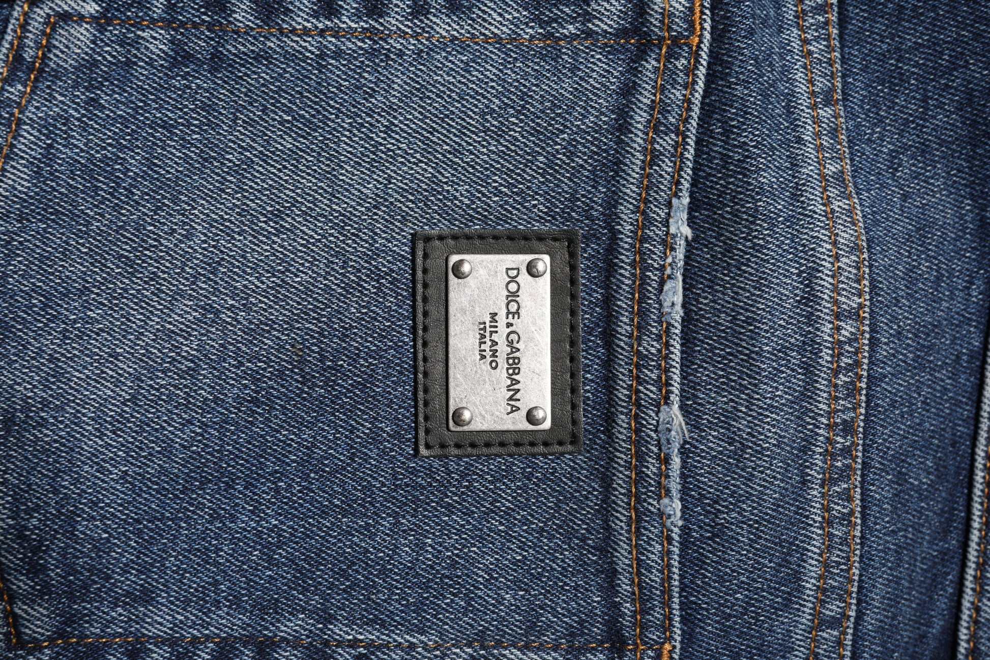 Blue denim jeans with a label on the waistband