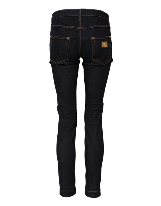 Pair of dark blue jeans with a lighter wash on the thighs