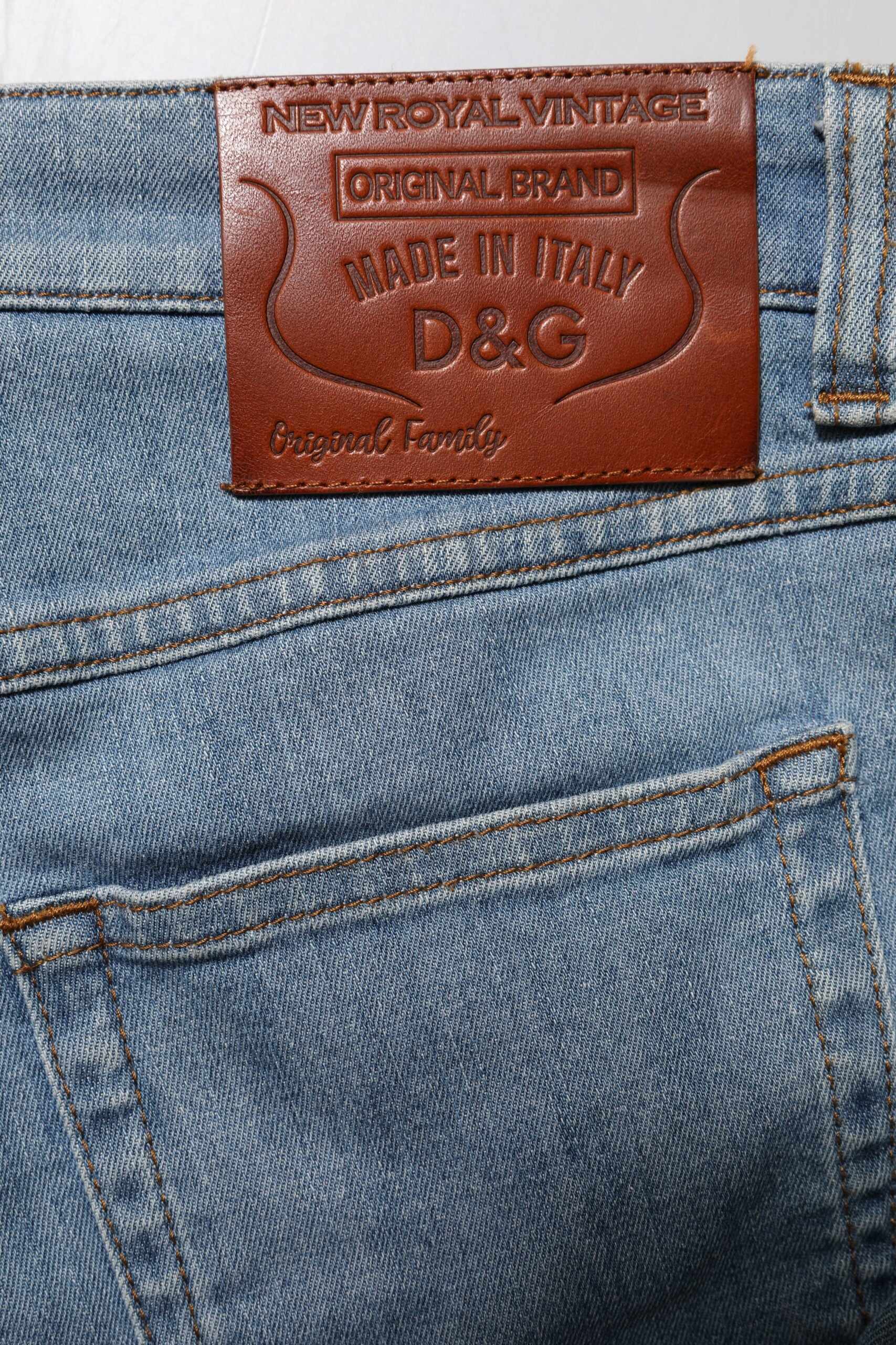 Blue denim jeans with brown leather label