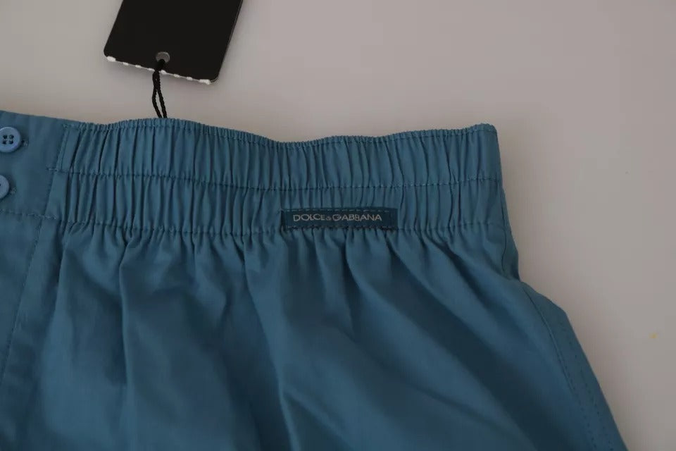 Blue shorts with a tag attached to the waistband