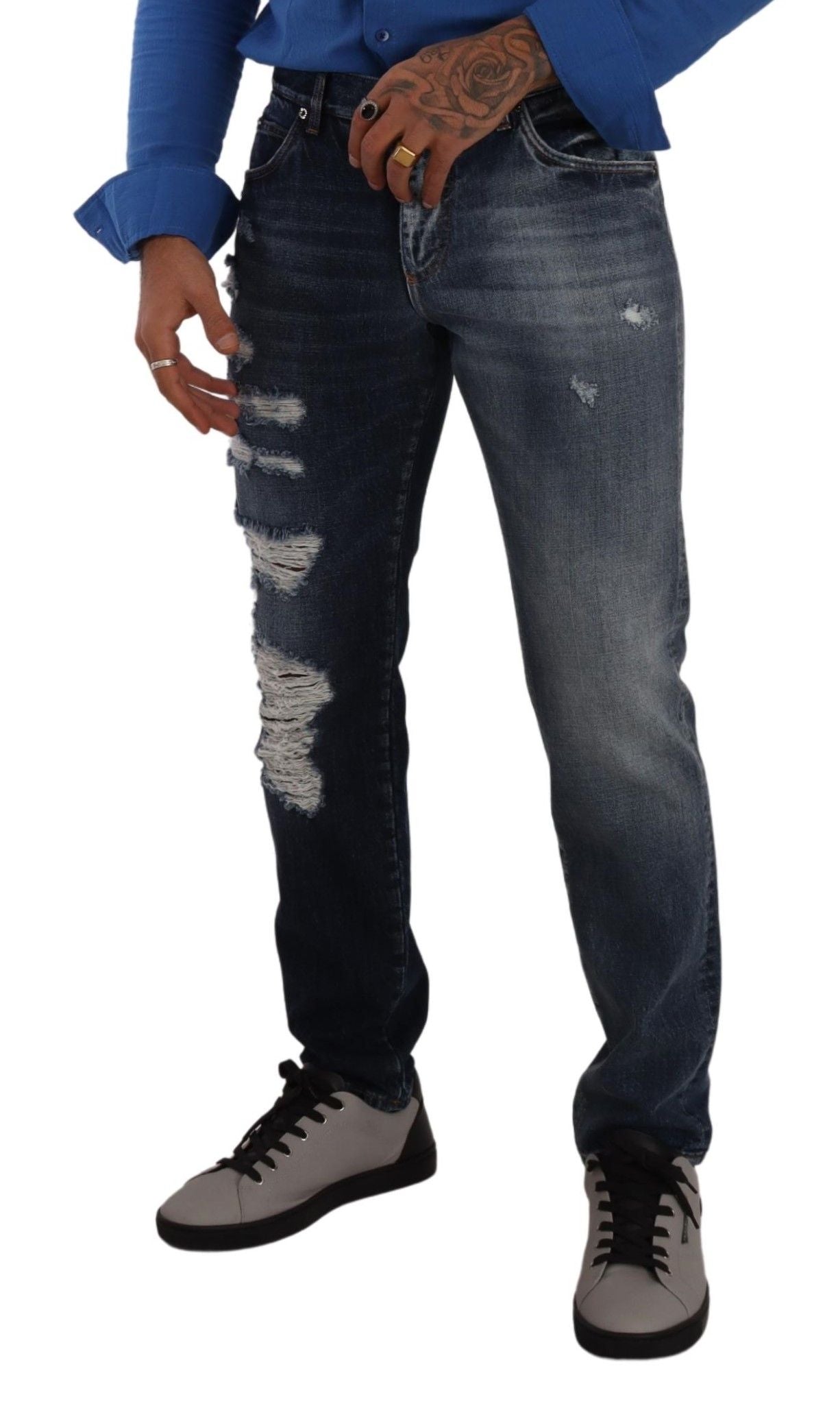 Man wearing blue jeans and white sneakers