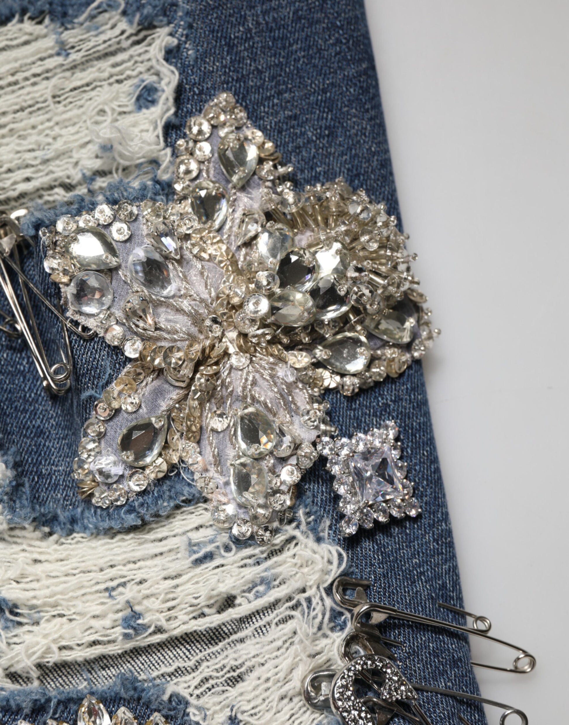 Decorative brooch on denim fabric
