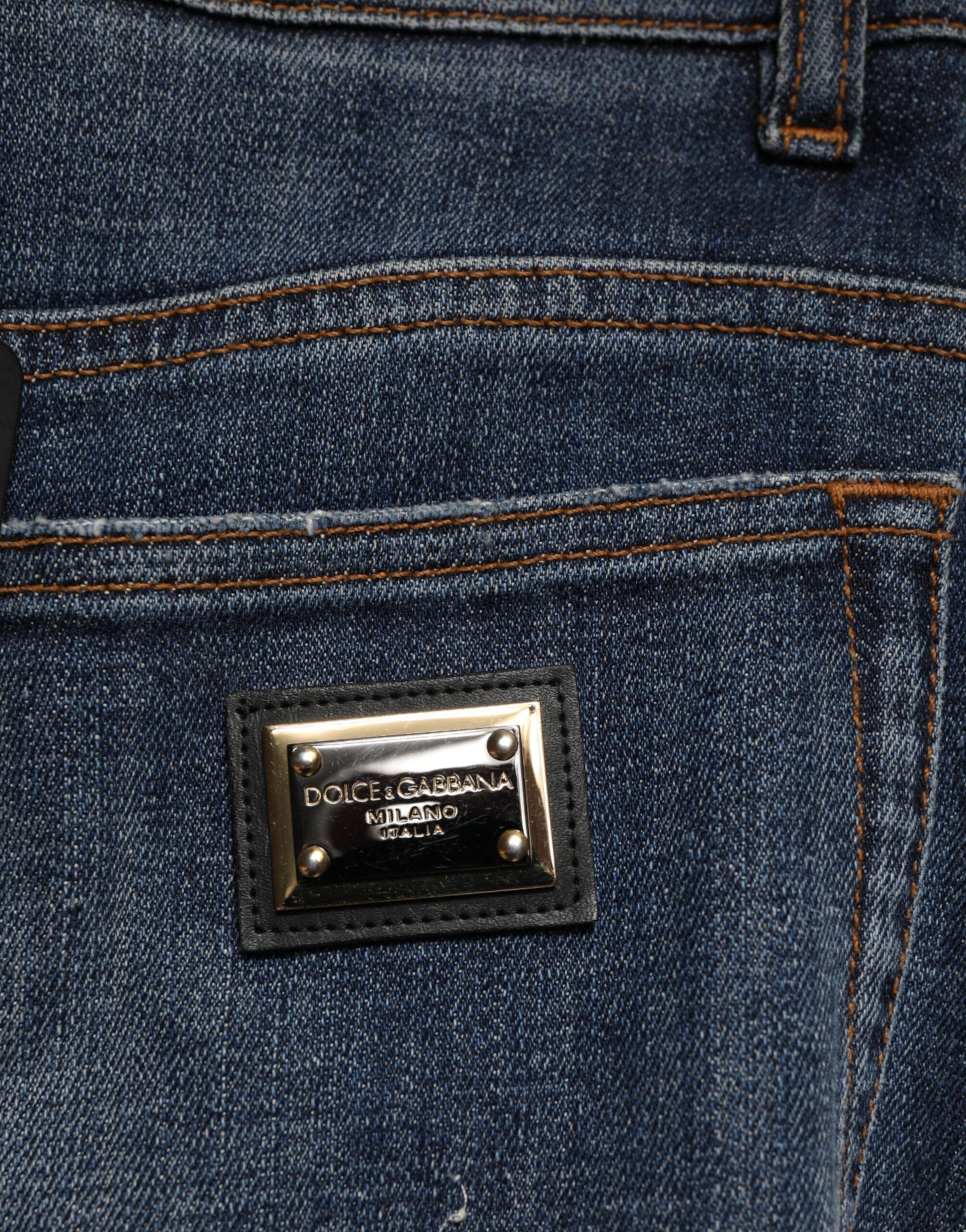 Blue jeans with a gold label on the back pocket