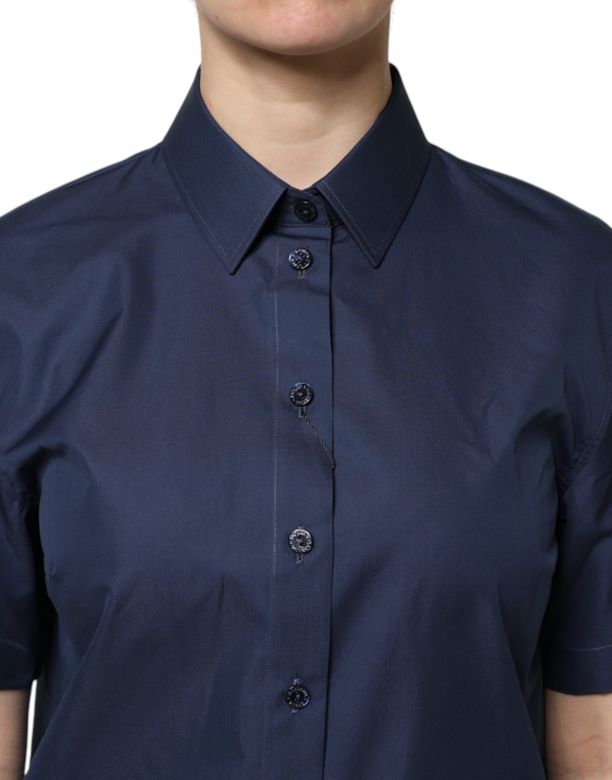 Woman wearing dark blue button up shirt