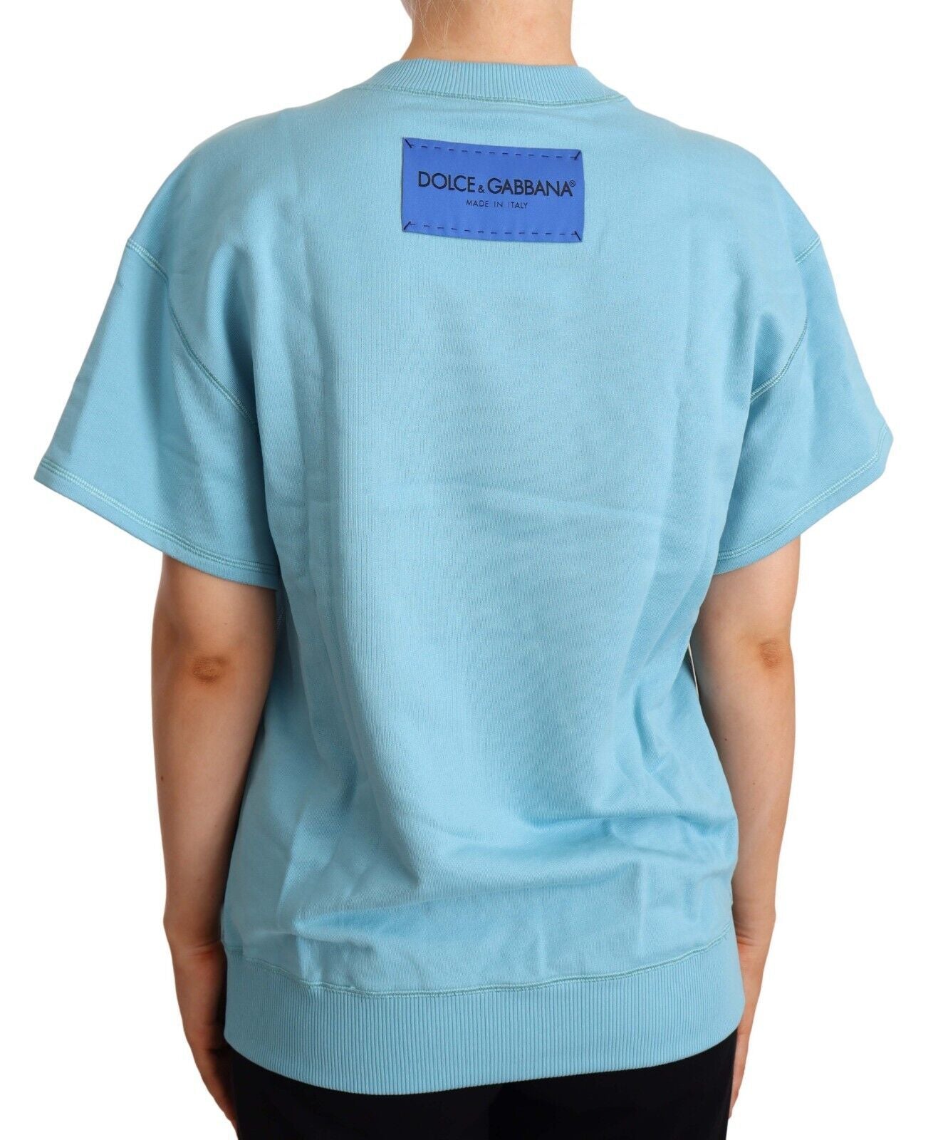 Blue short sleeve shirt with tag on back