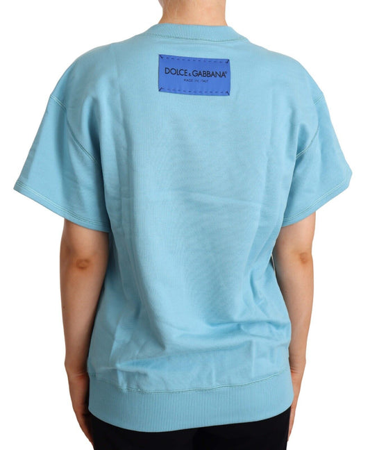 Blue short sleeve shirt with tag on back