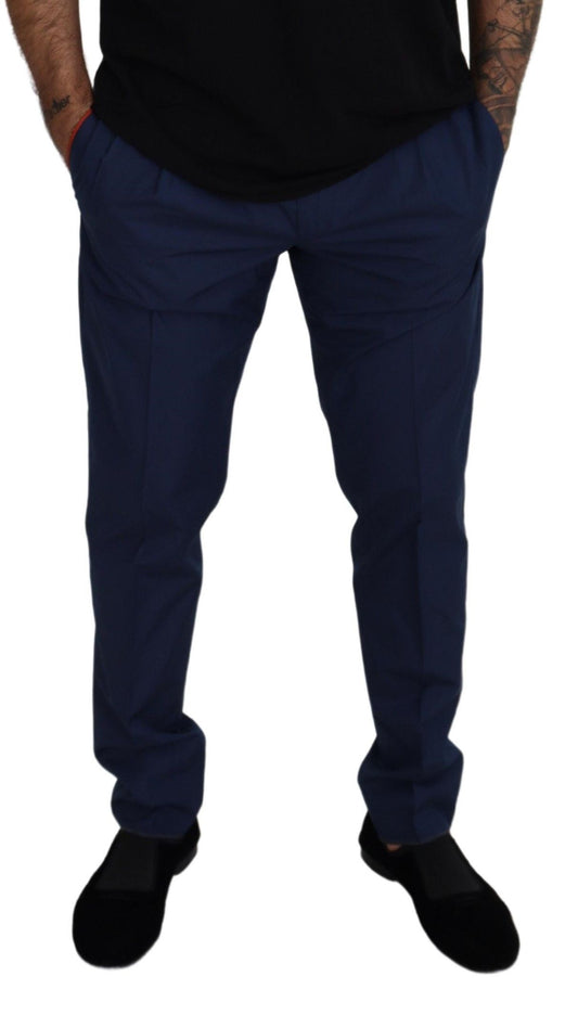 Man wearing blue pants and black shoes