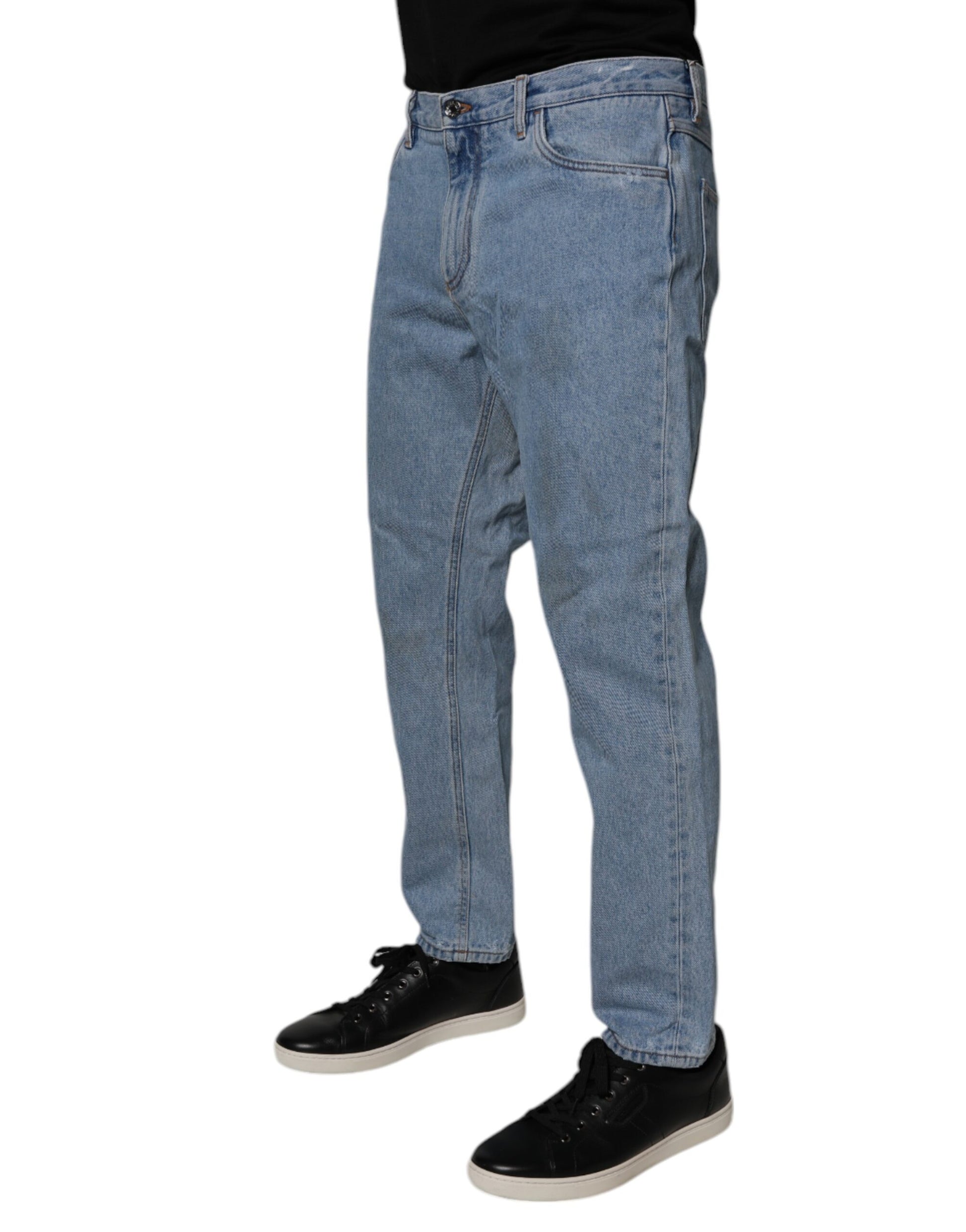 Man wearing blue jeans and black shoes