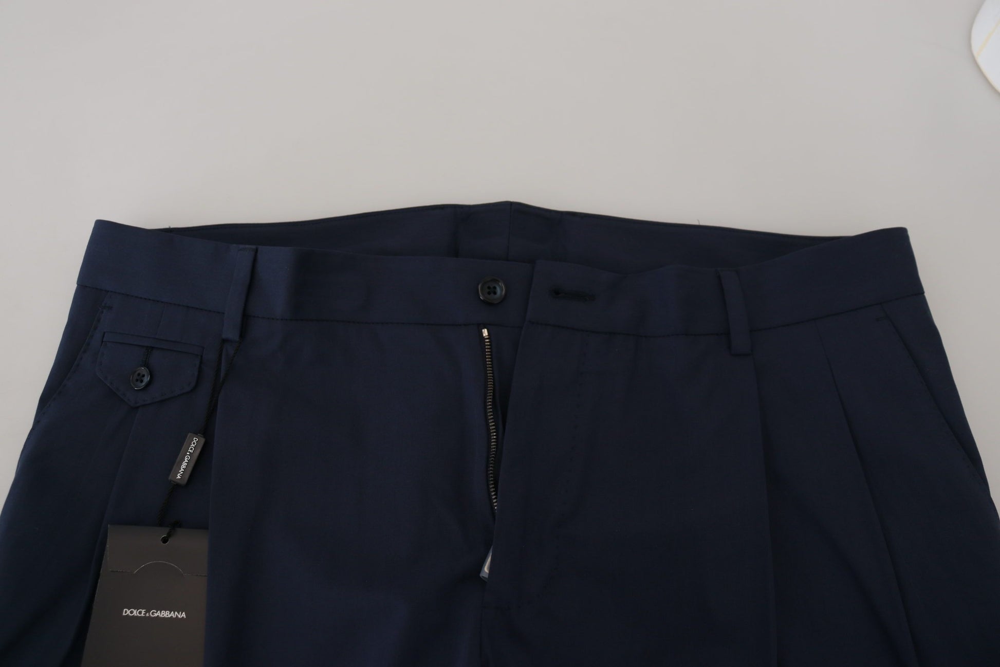 Navy blue trousers on a table