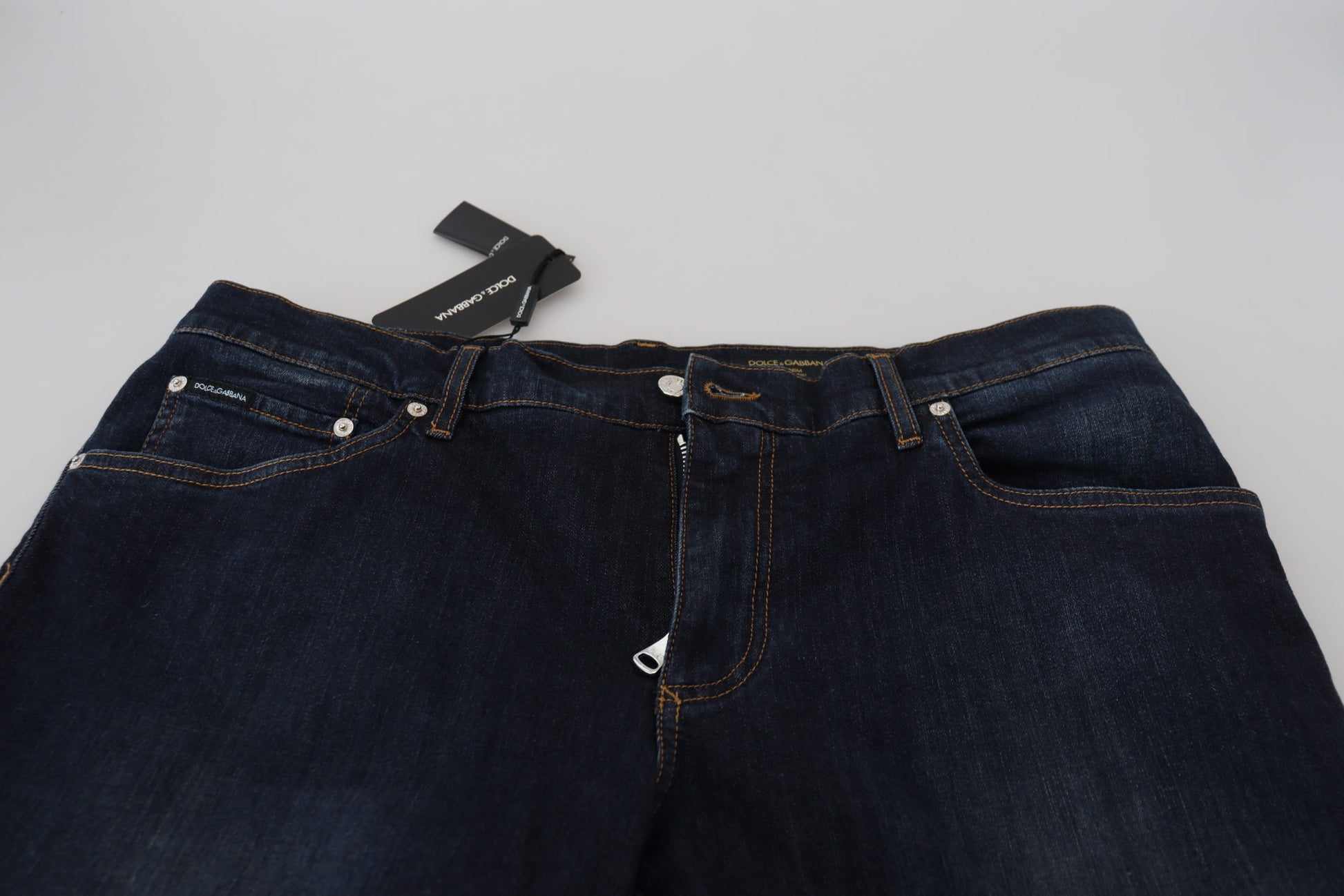 Pair of blue jeans on a white surface