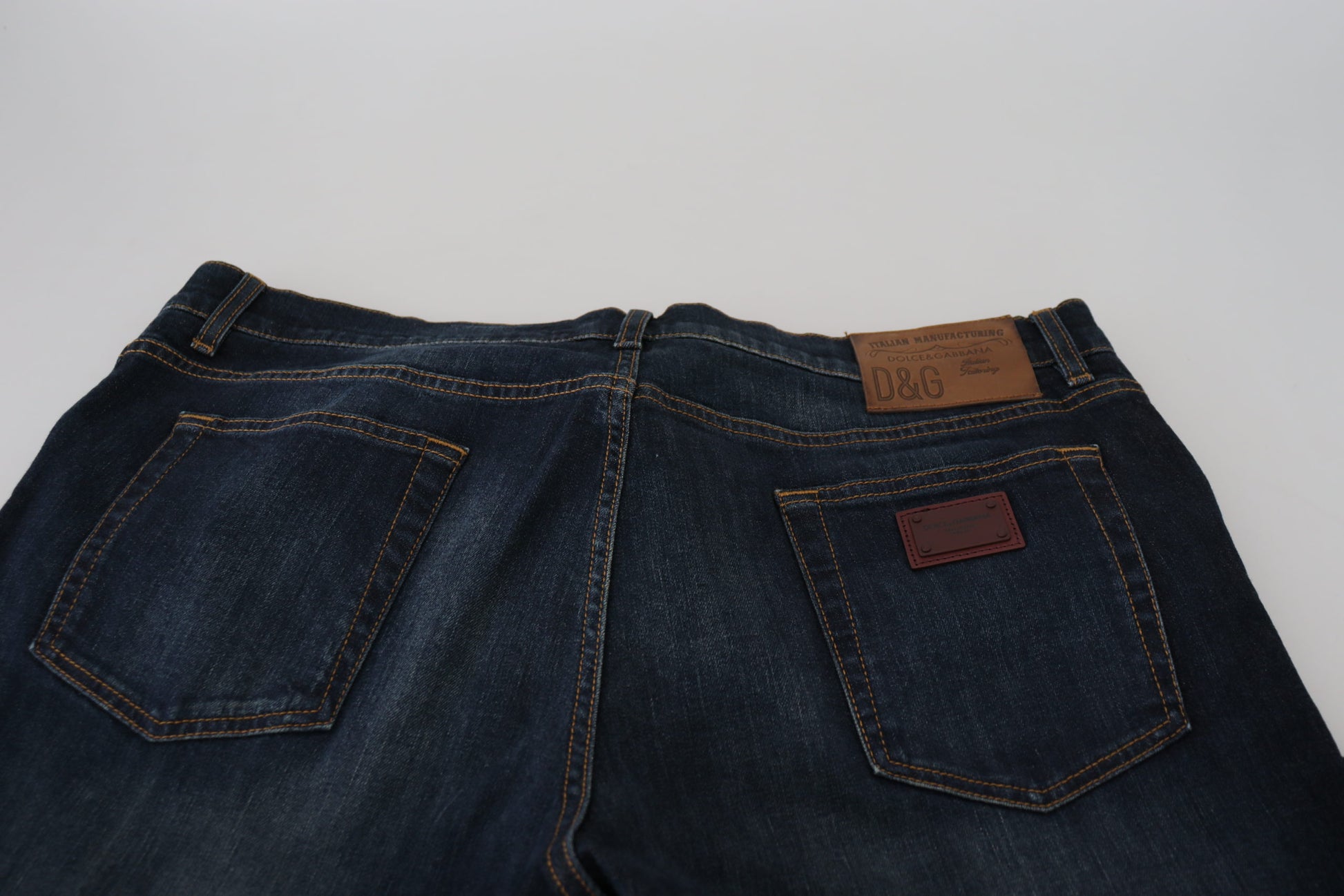 Pair of blue jeans with brown leather patch on back pocket