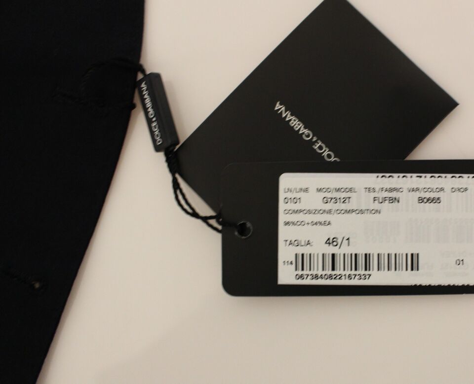 A black tag with white text on a blue cotton stretch dress vest blazer