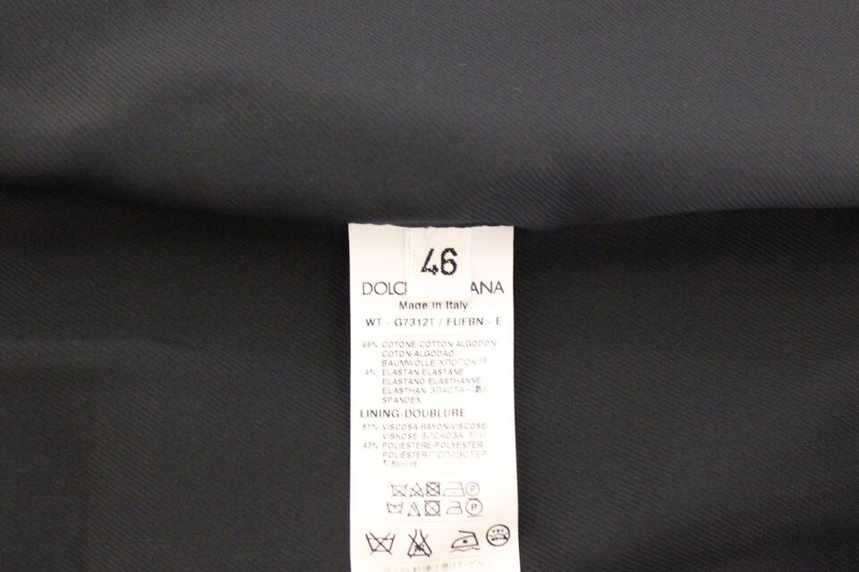 A blue cotton stretch dress vest blazer with a tag indicating it is from the brand Dolce & Gabbana