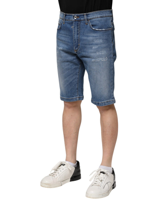 Man wearing blue denim shorts and white sneakers