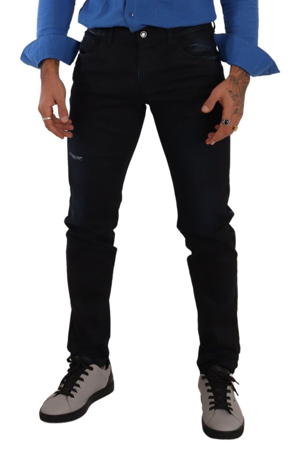 Man wearing blue jeans and black shoes