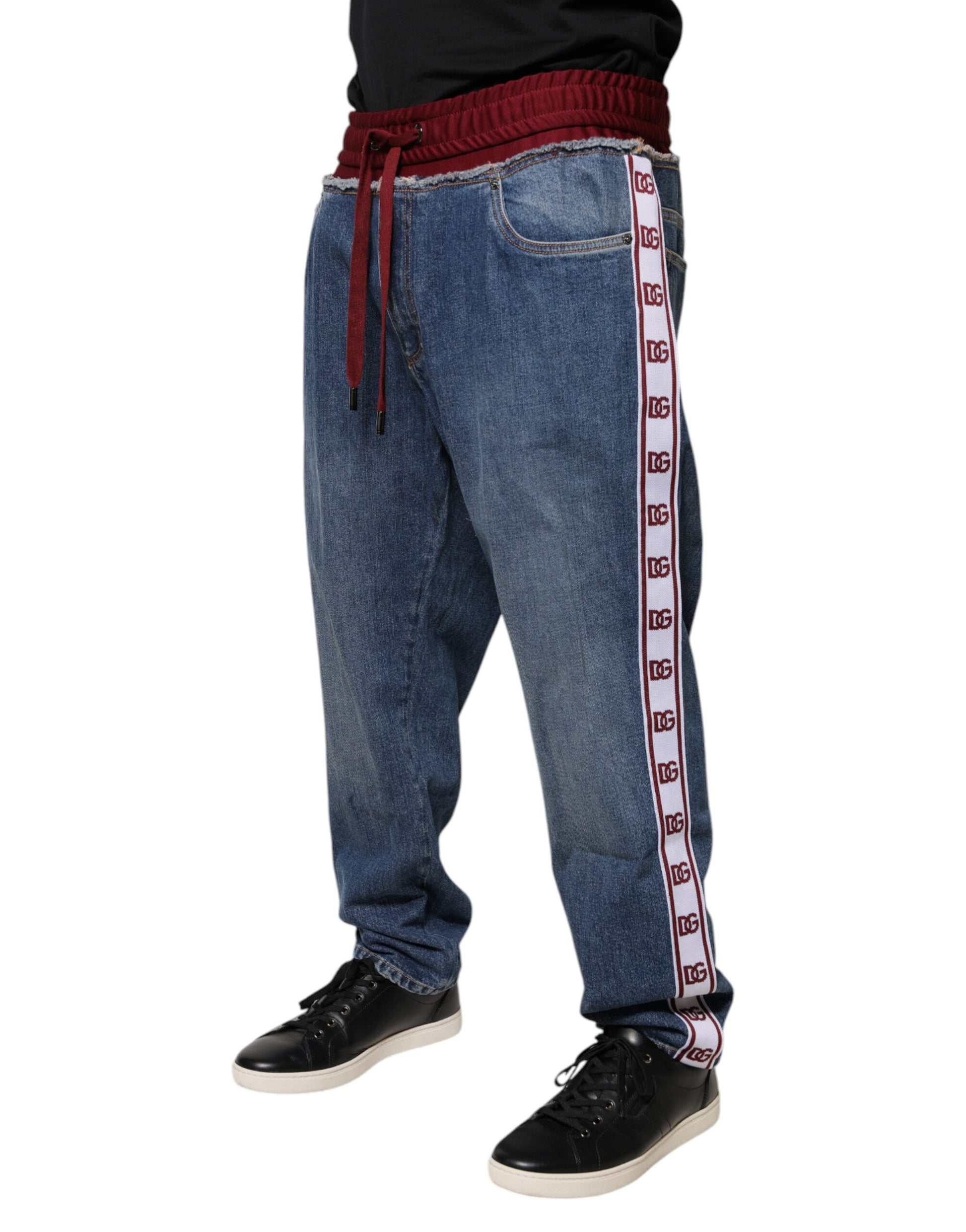 Man wearing blue jeans with red stripe down side