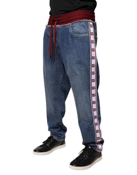 Man wearing blue jeans with red stripe down side