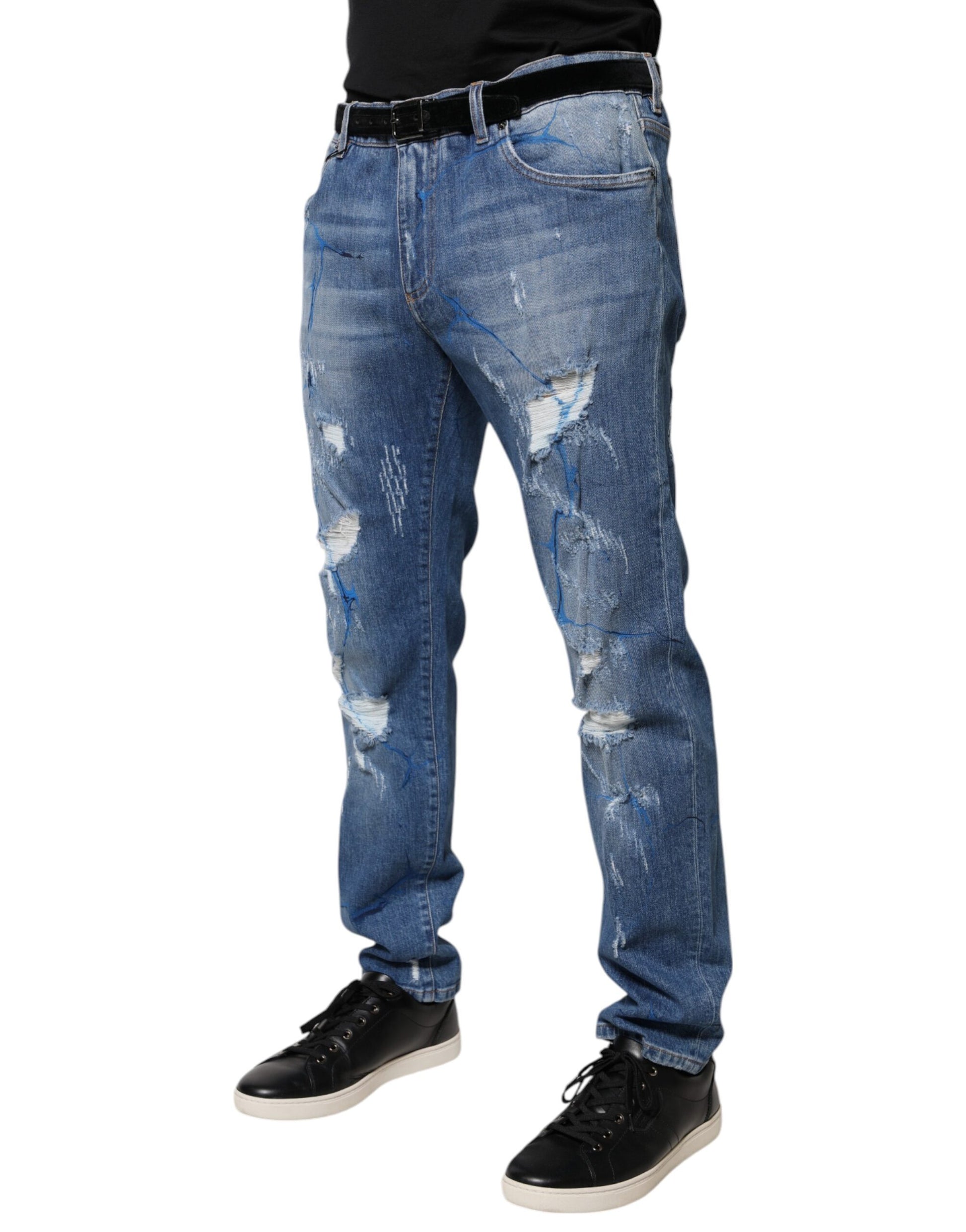 Man wearing blue jeans with holes and rips