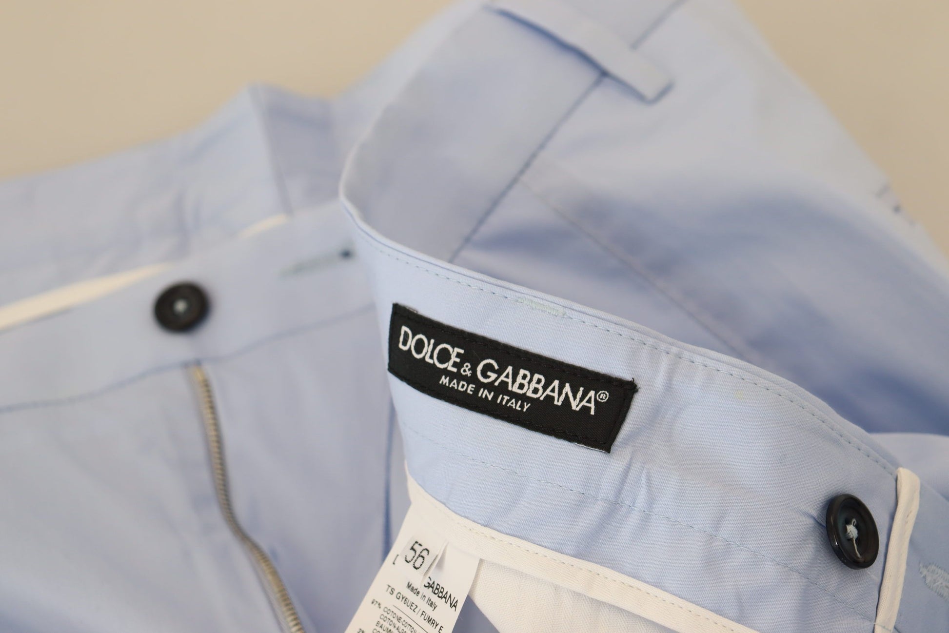 Blue raincoat with zippered front pocket