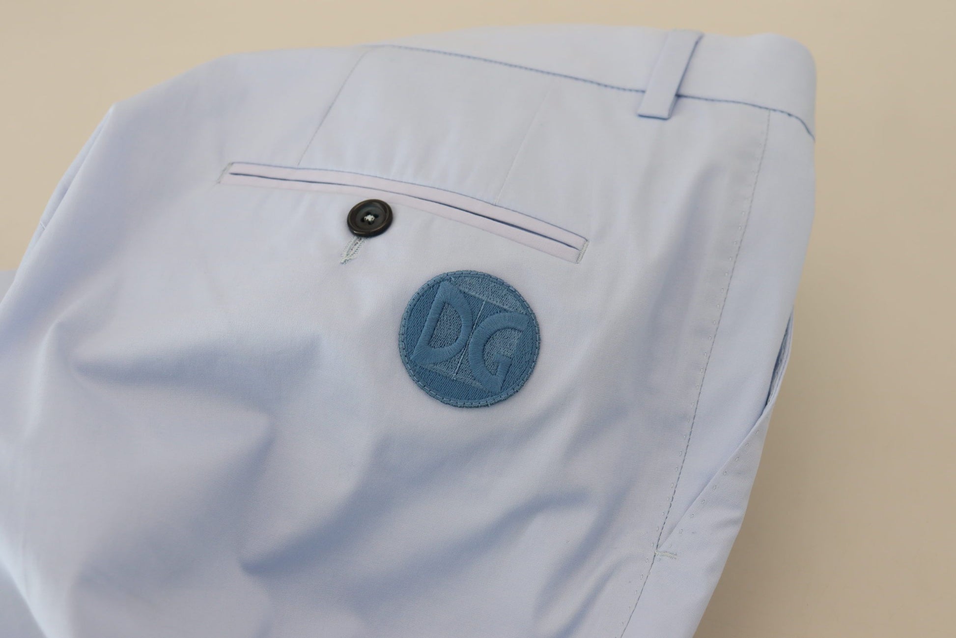 Blue shirt with a logo on the left chest area
