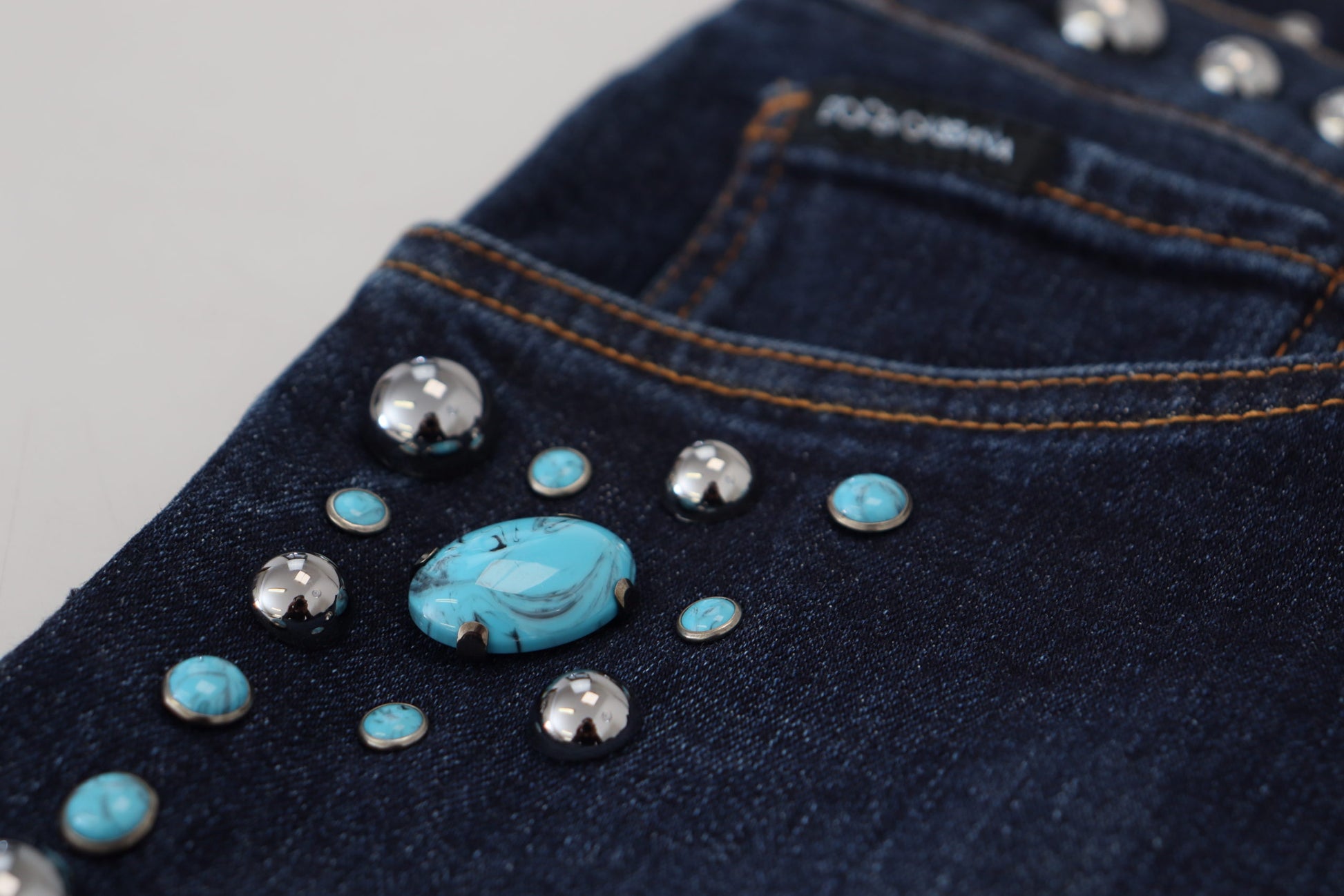 Blue jeans with turquoise stones on front