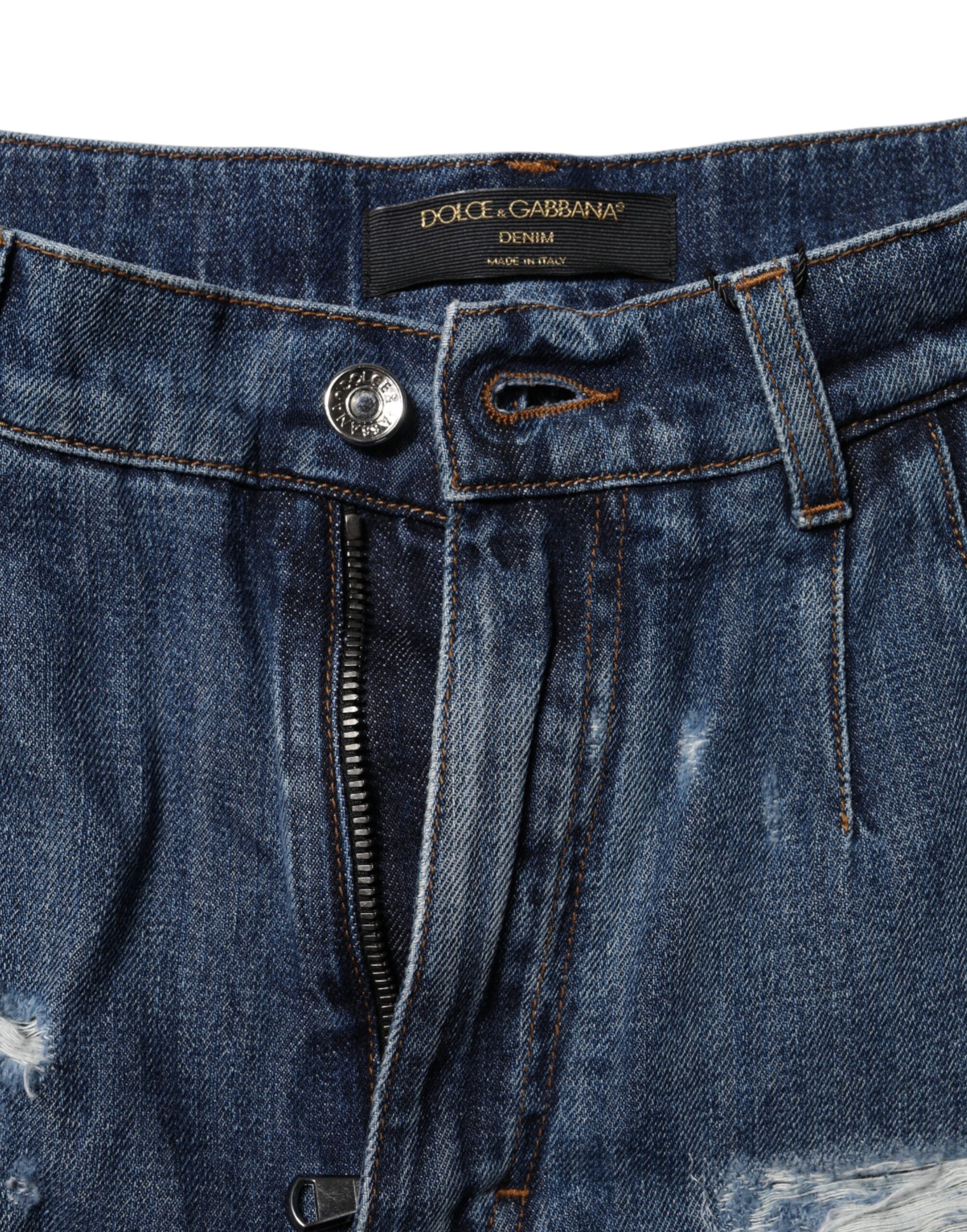 Blue denim jeans with zipper fly and button closure