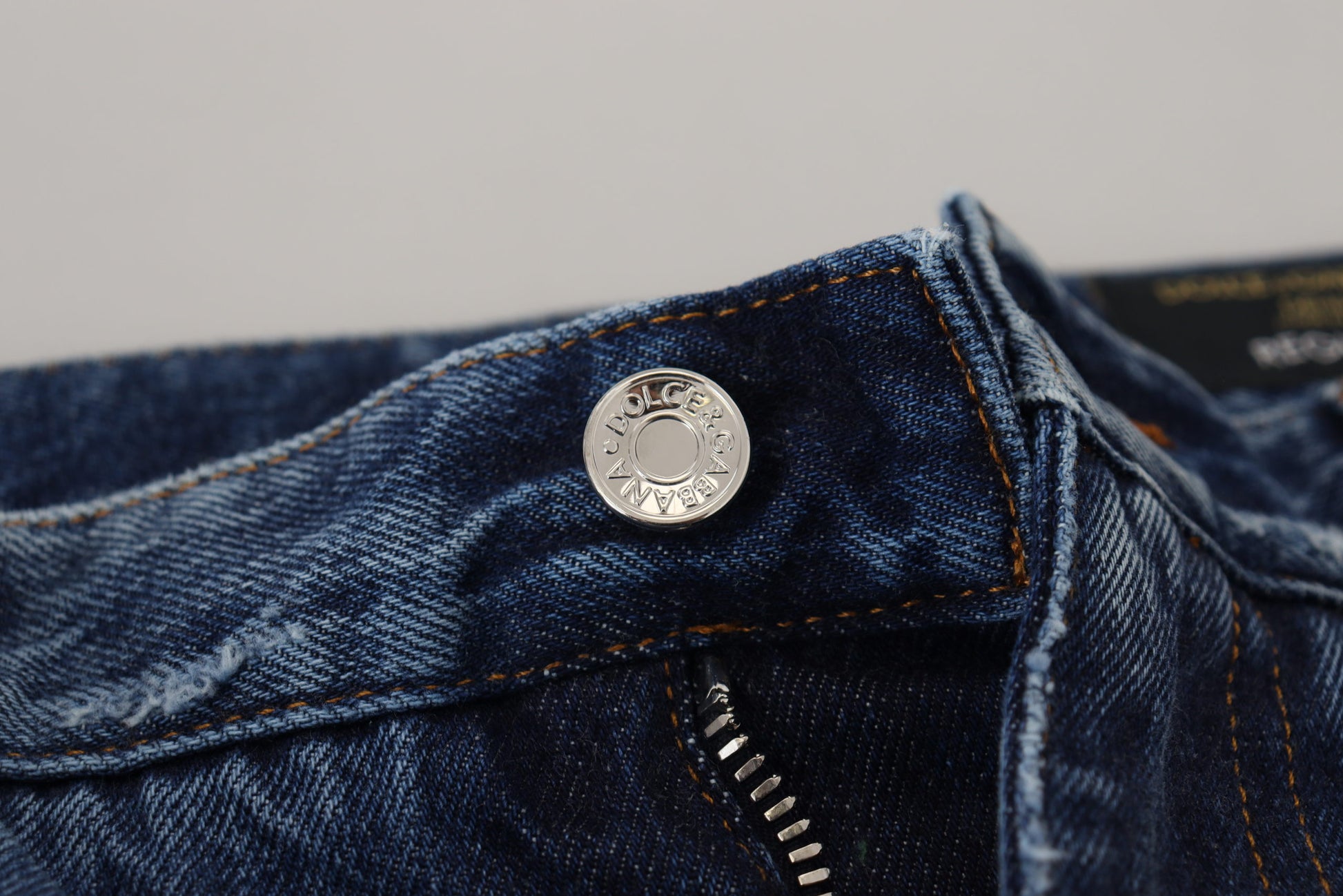 Blue denim jeans with silver button