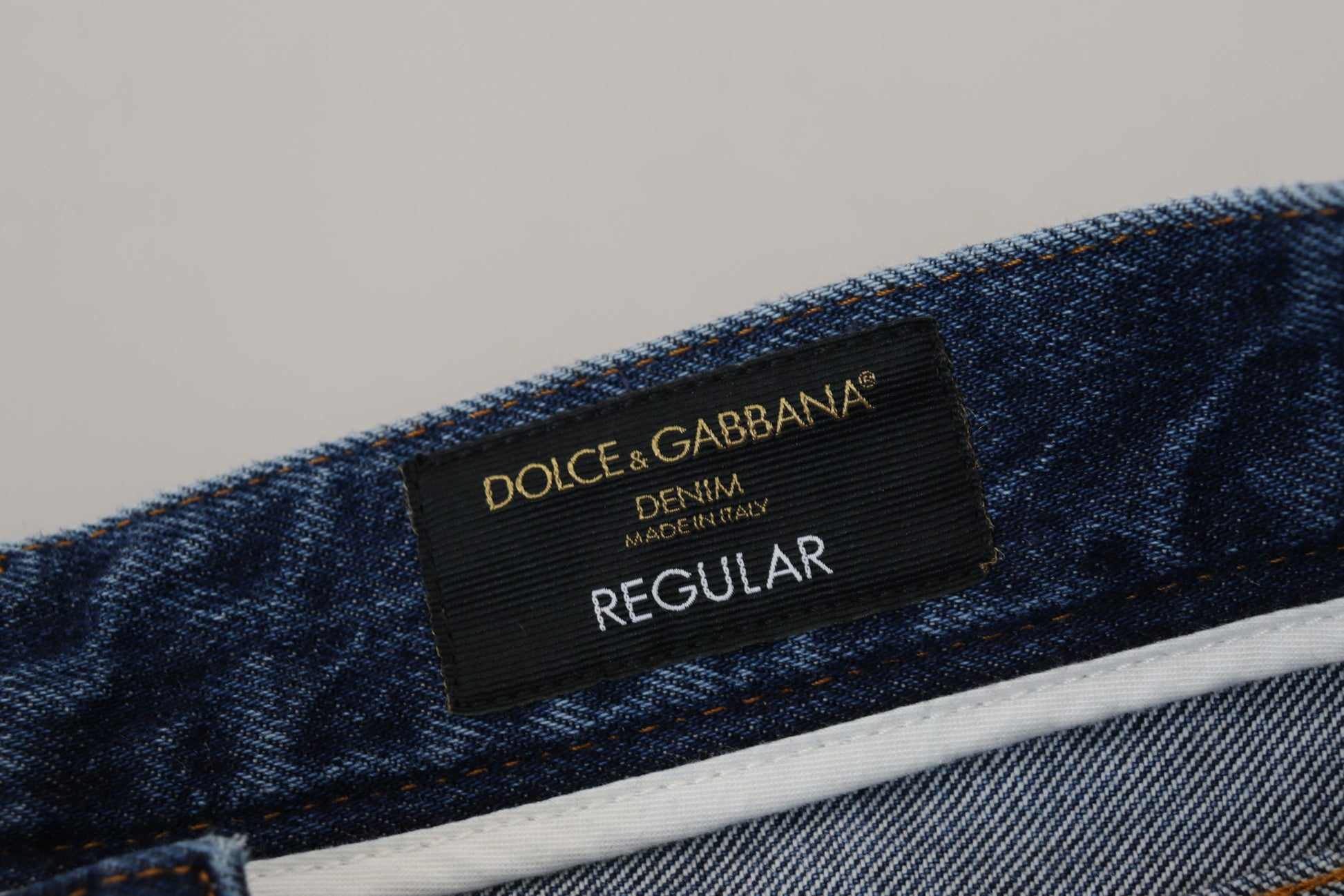 Blue denim jeans with white label on waistband