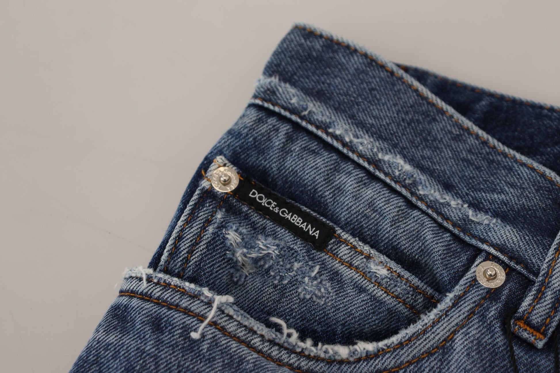 Blue denim jeans with brand label on waistband