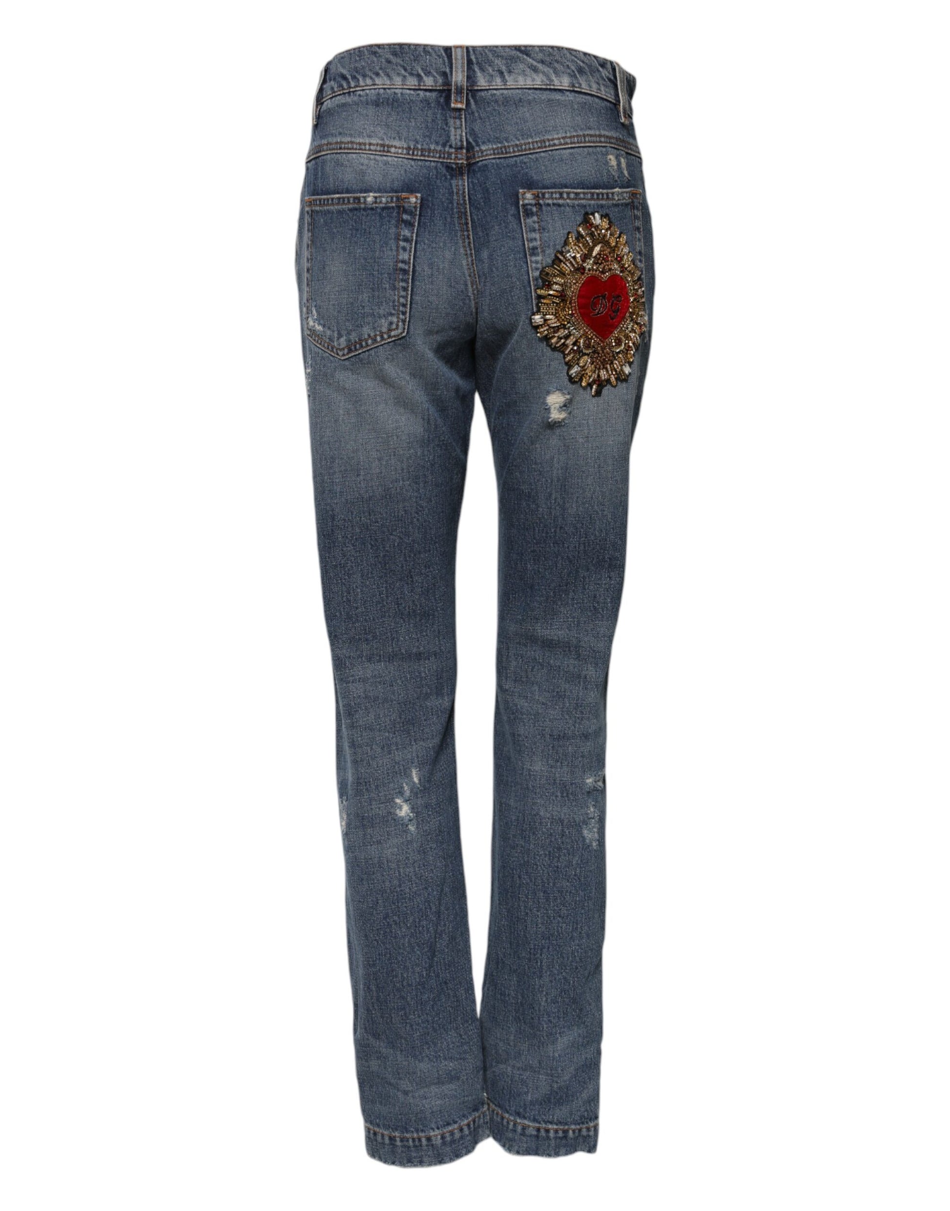 Pair of blue jeans with embroidered red flower on right leg