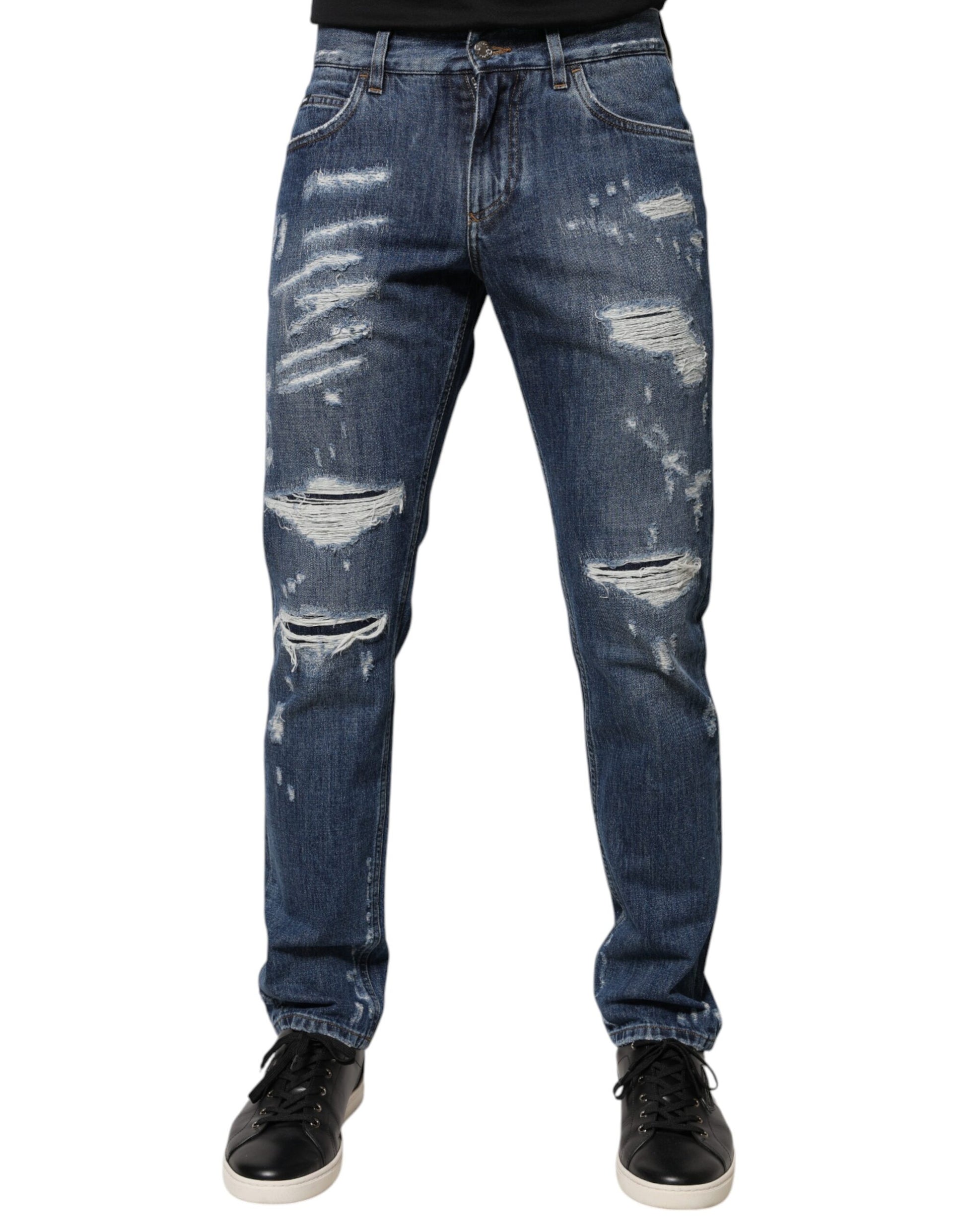 Pair of distressed blue jeans with holes and rips