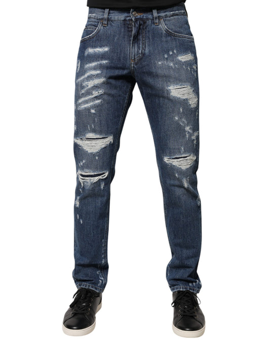 Pair of distressed blue jeans with holes and rips