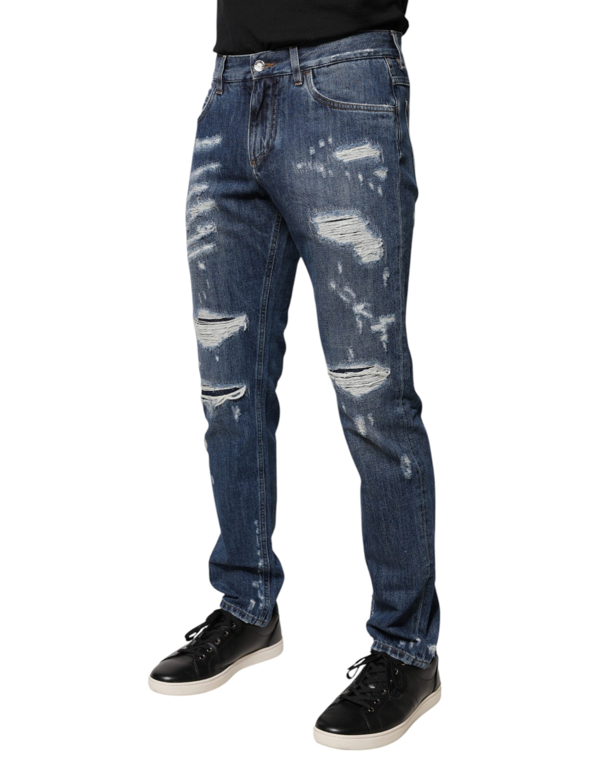 Man wearing blue jeans with holes and rips