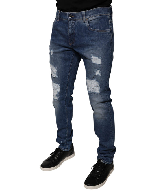 Man wearing blue jeans with distressed areas