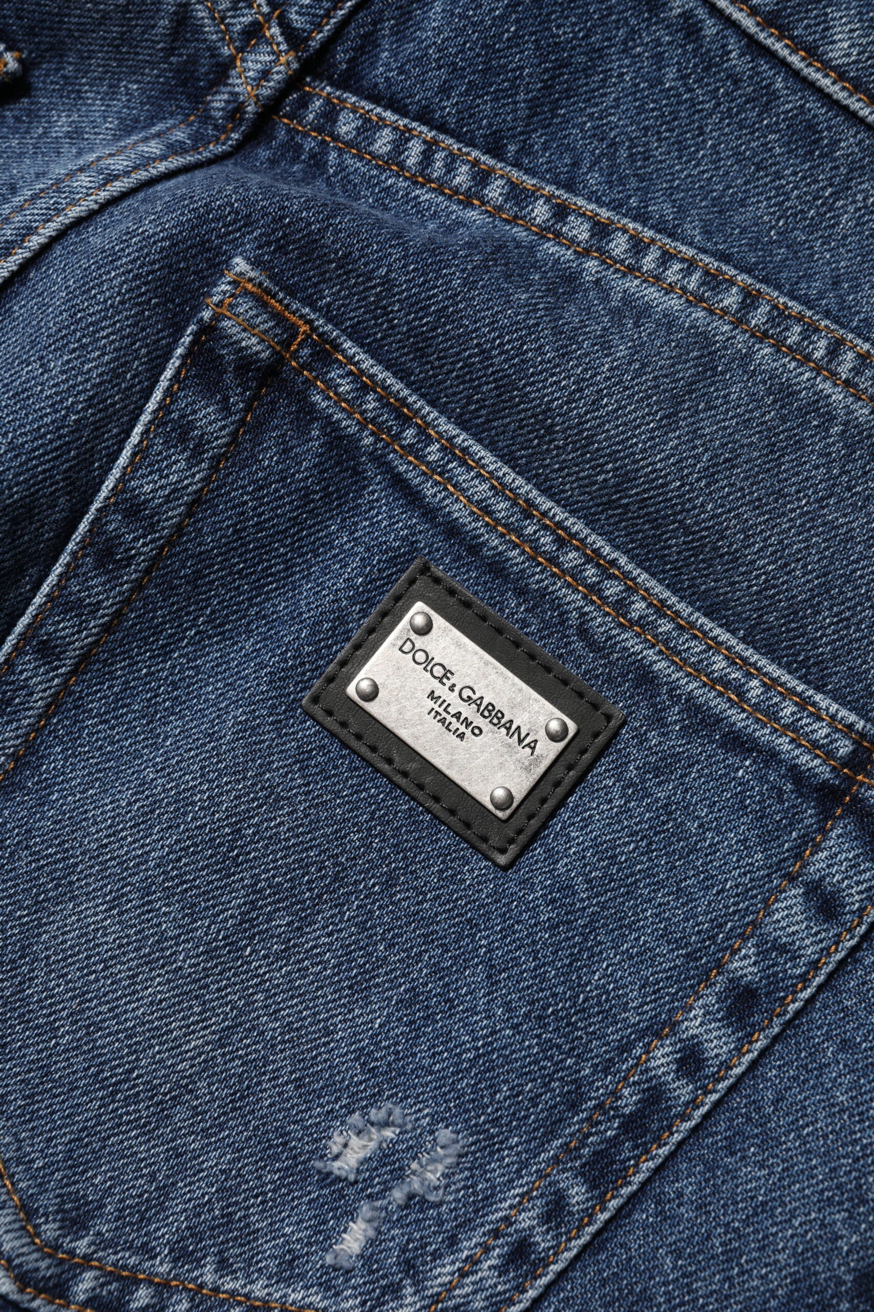 Blue denim jeans with a brand label on the back pocket