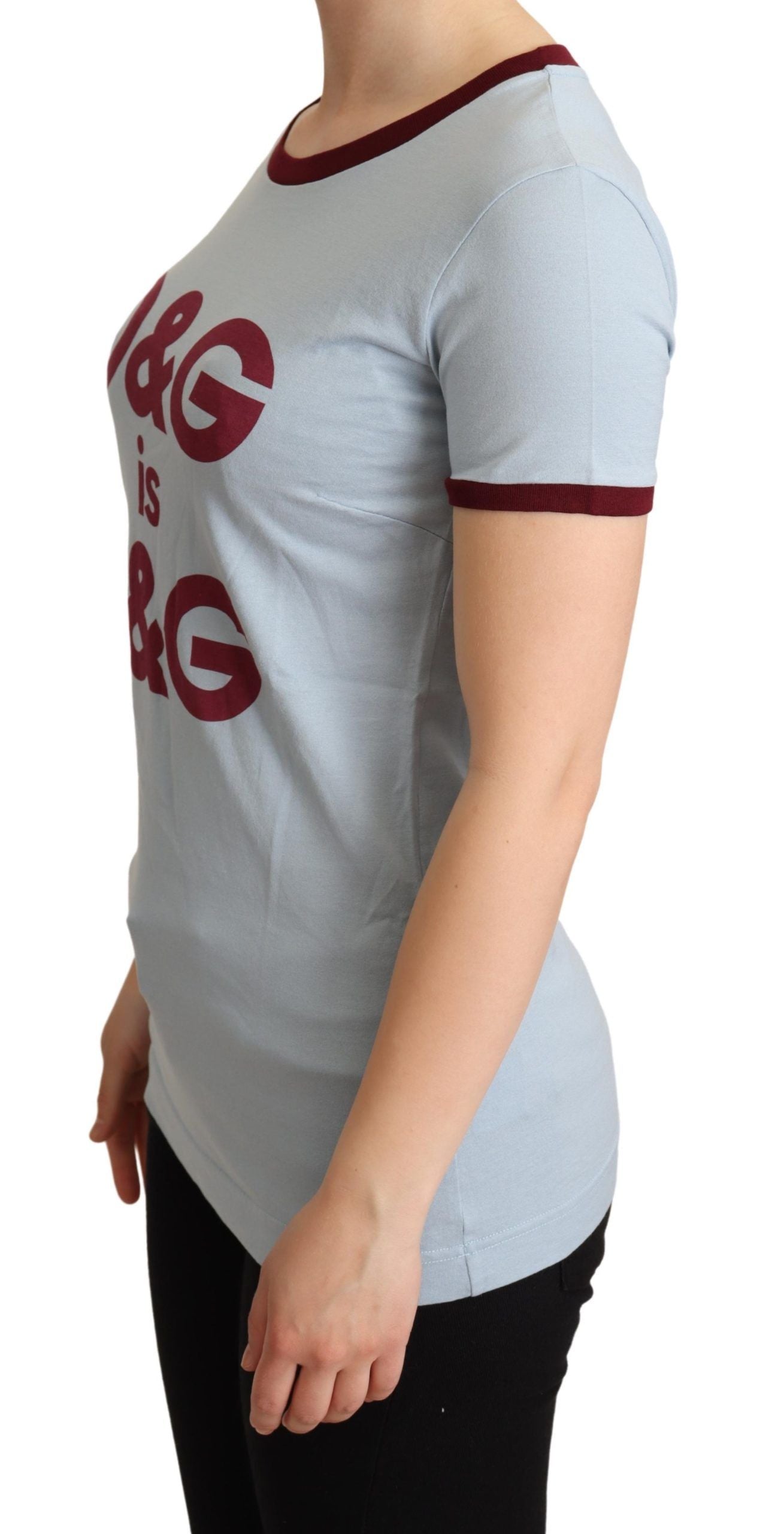 Woman wearing gray t-shirt with red lettering