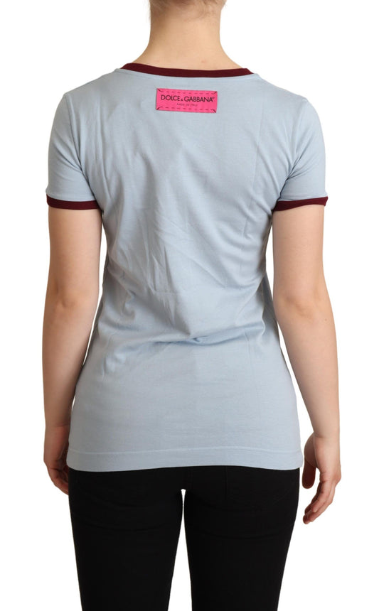 Woman's back wearing a short sleeve shirt with pink label on back