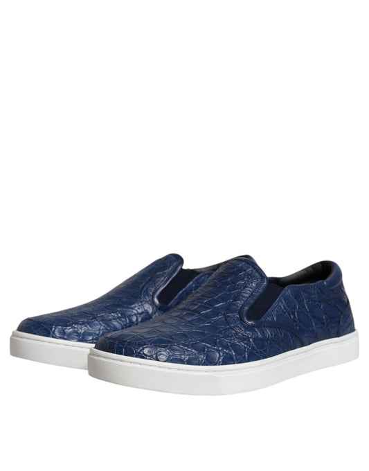 Blue slip on shoes with white soles and laces