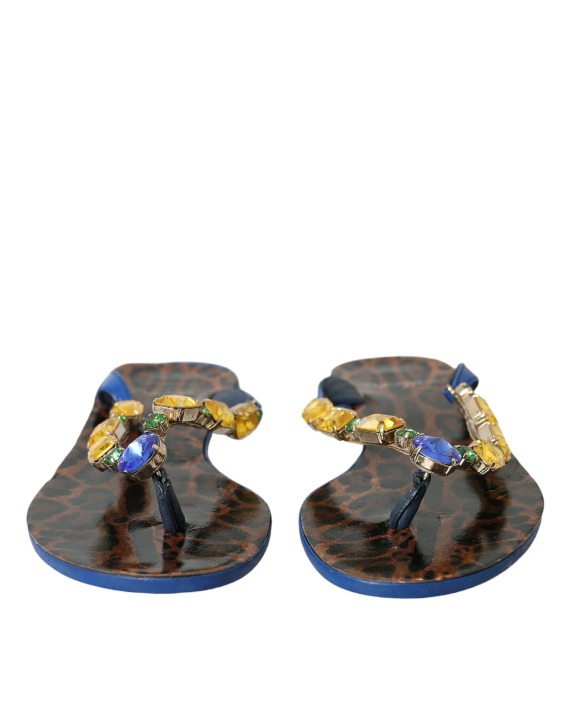 Pair of colorful flip flops with blue straps and decorative stones
