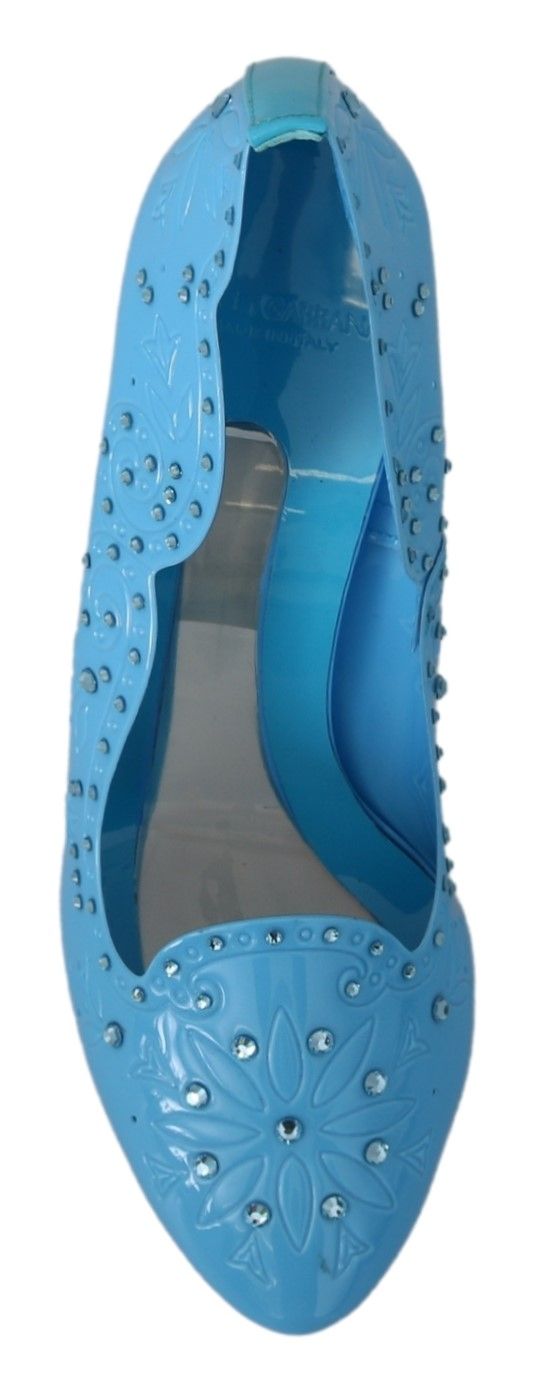 Blue high heel shoe with embellishments and a strap over the toe