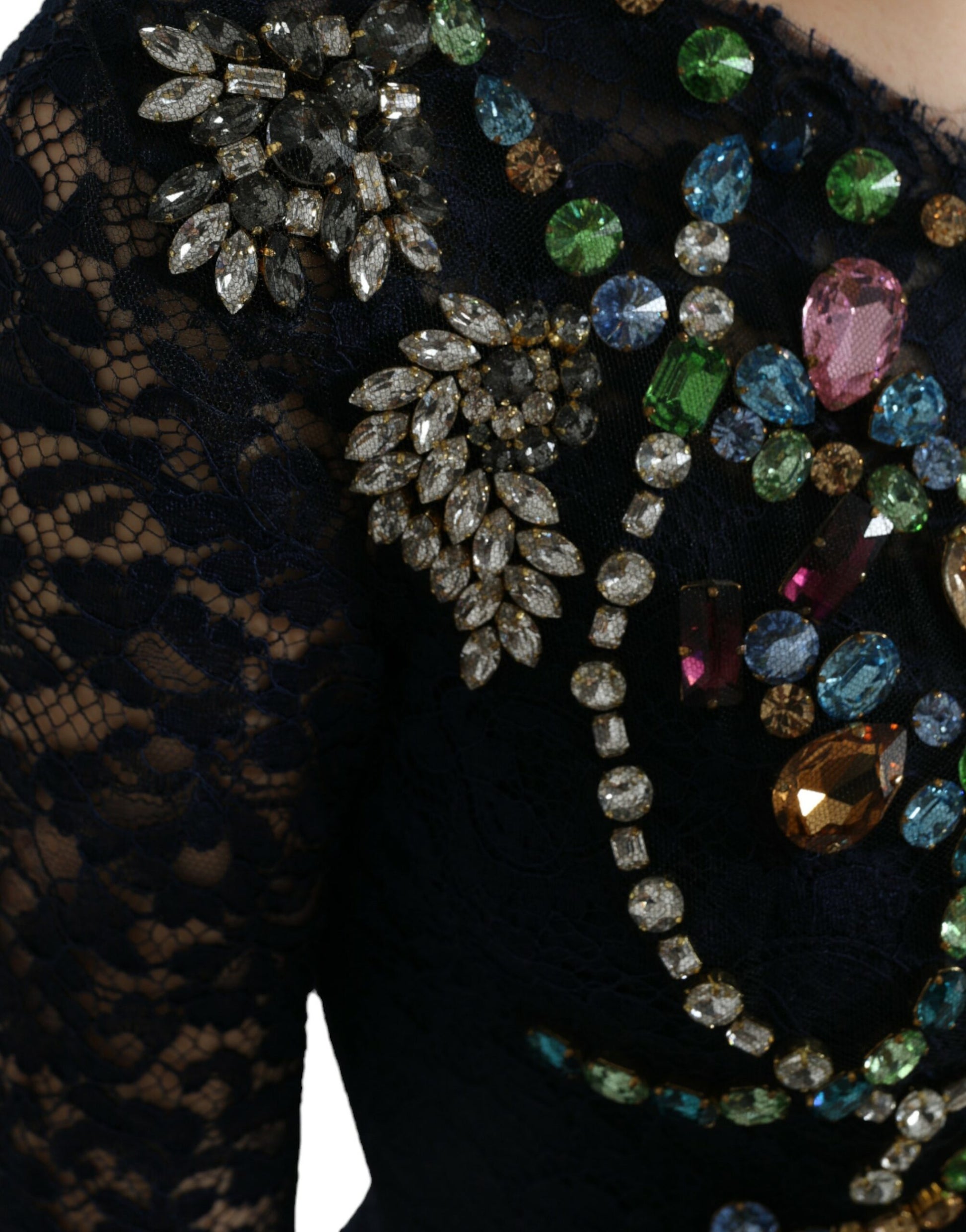 A black lace dress with a floral pattern and crystals on the bodice