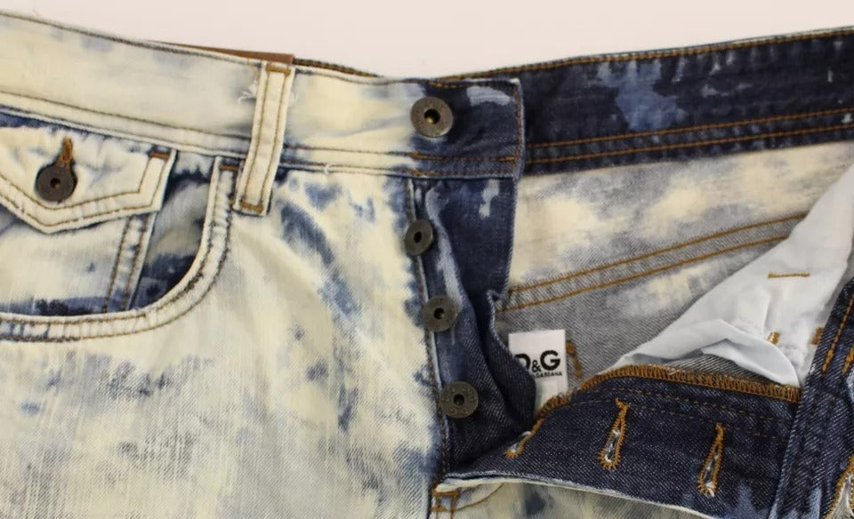 Blue denim jeans with distressed design