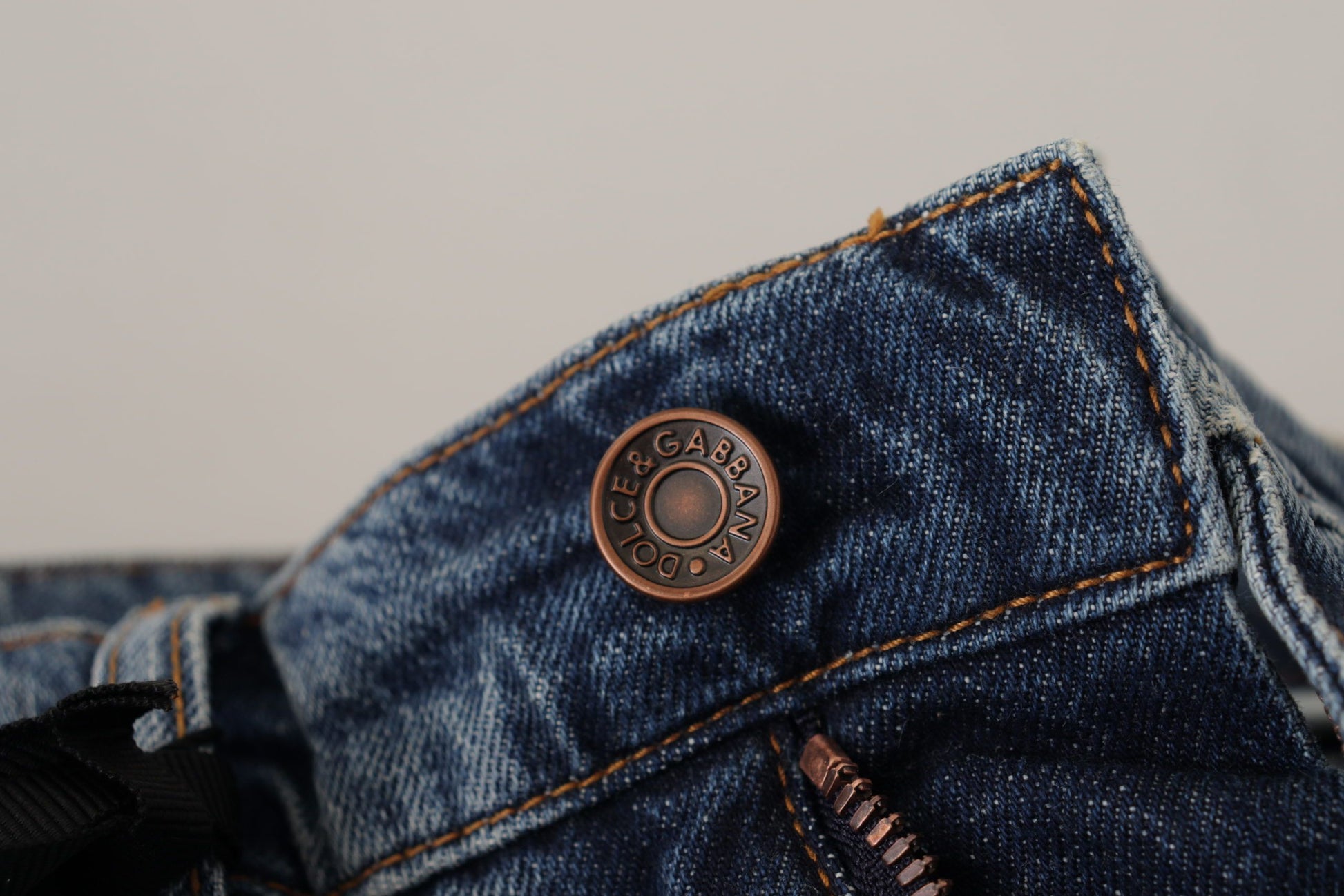 Blue denim jeans with button closure