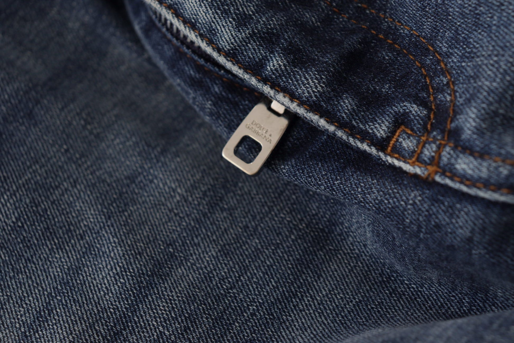 Blue denim jeans with metal button closure