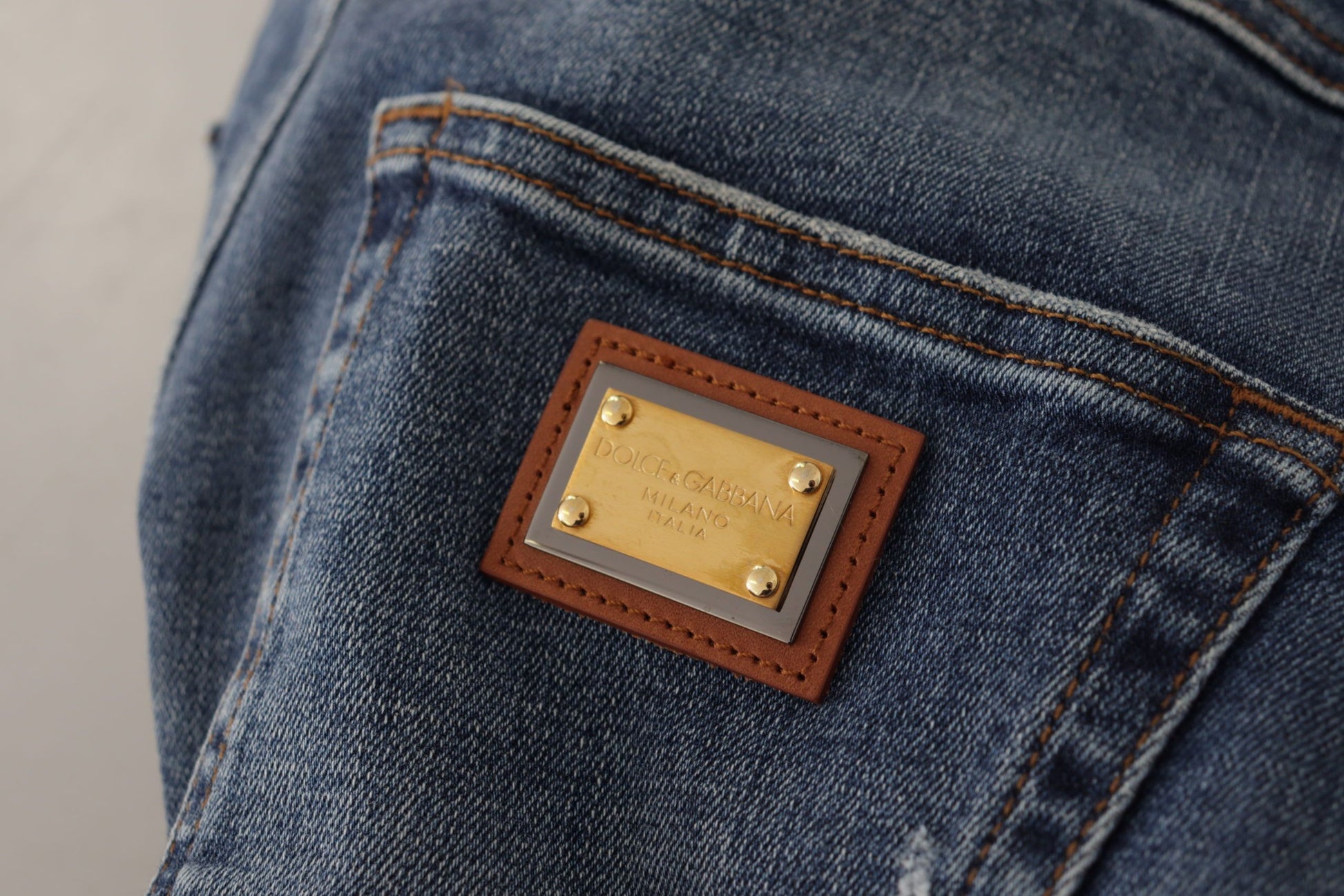 Blue jeans with brown leather patch on back pocket
