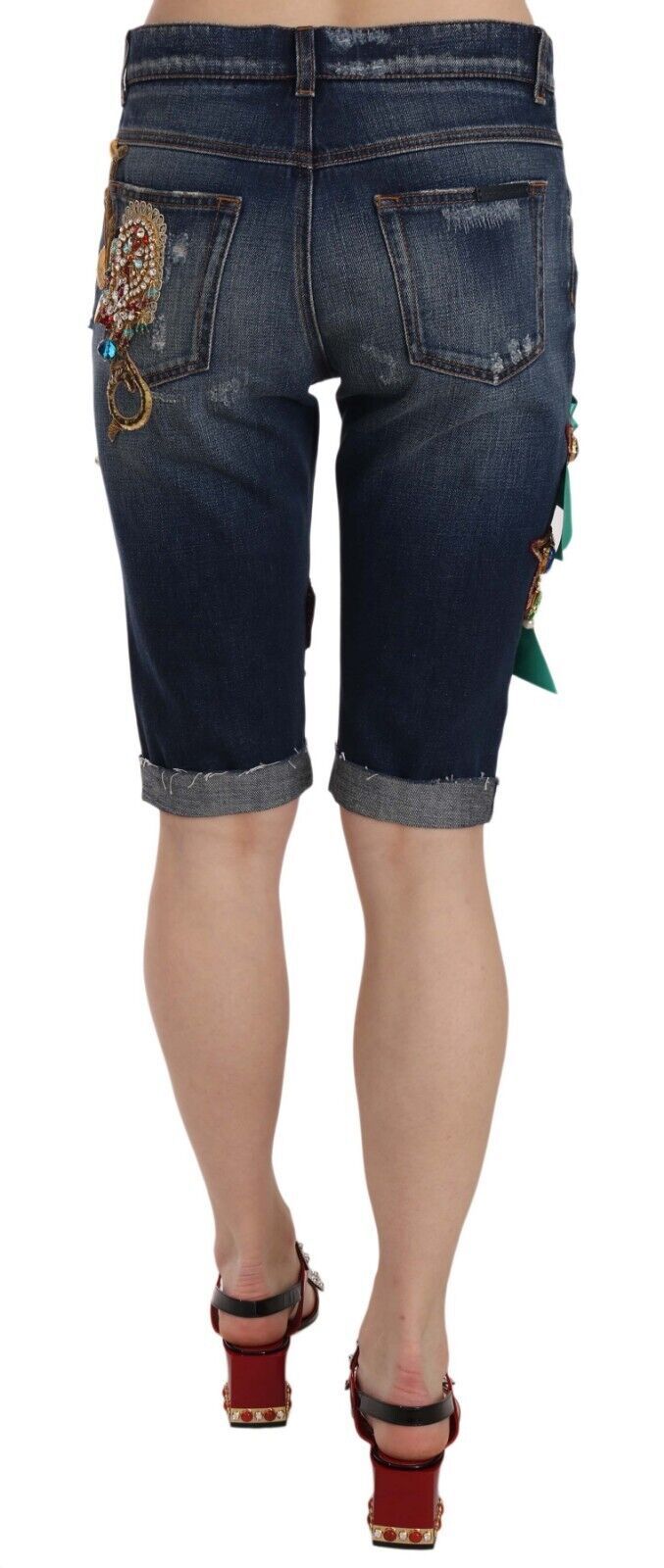 Pair of denim shorts with embroidered design on legs