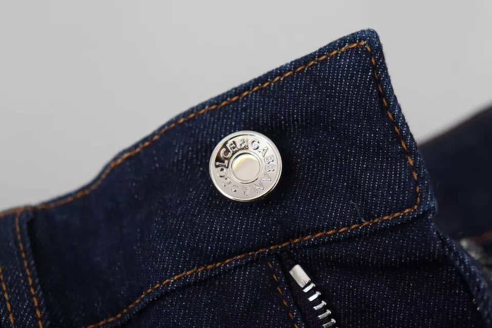 A pair of blue denim stretch crystal hot pants shorts with a silver button