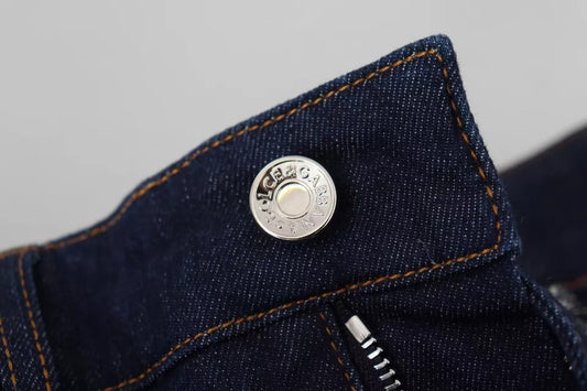 A pair of blue denim stretch crystal hot pants shorts with a silver button